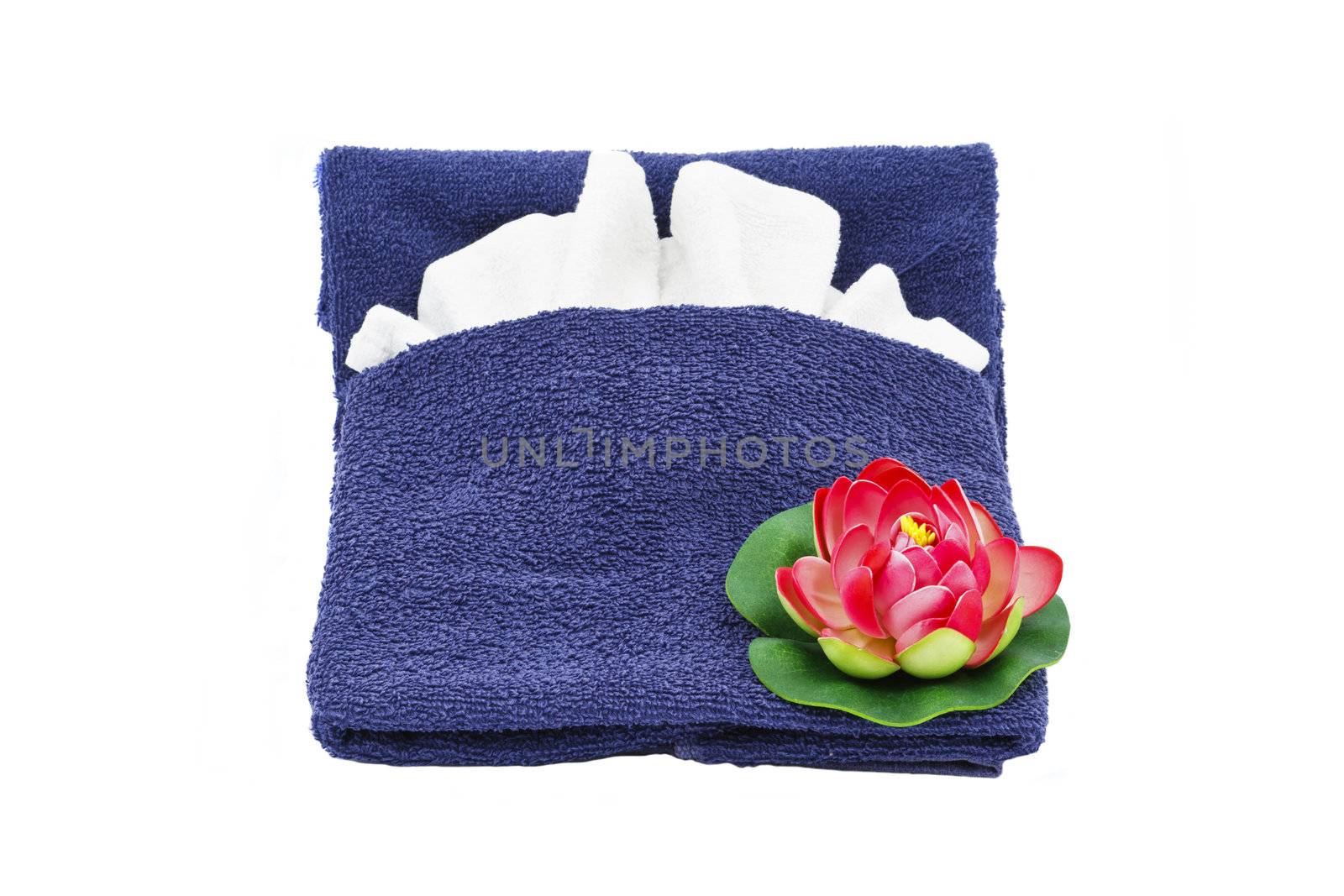 Beautiful decoration with blue towel and red flower isolated on white