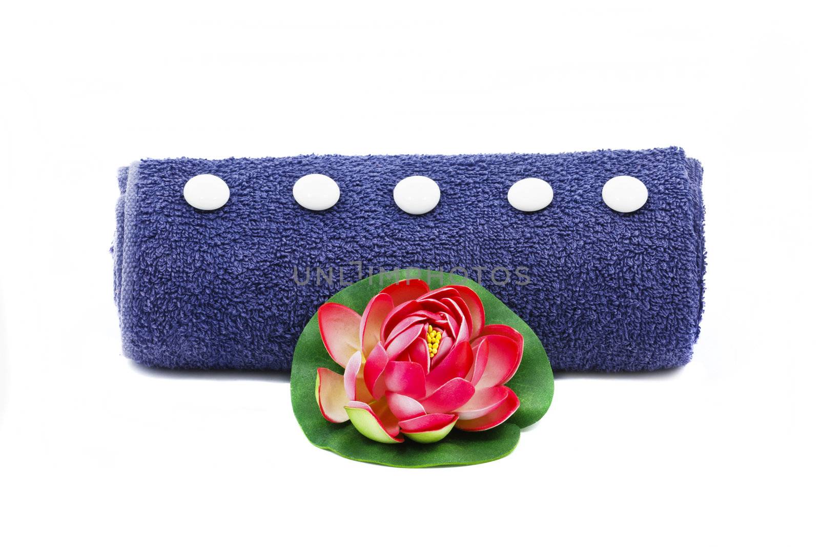 Beautiful decoration with blue towel and red flower isolated on white