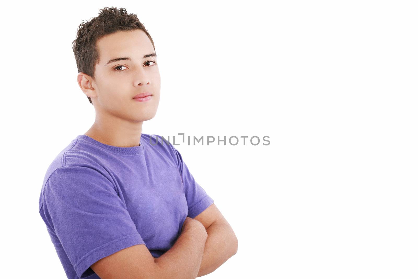 Portrait of a happy teenager standing with folded hands on isolated background