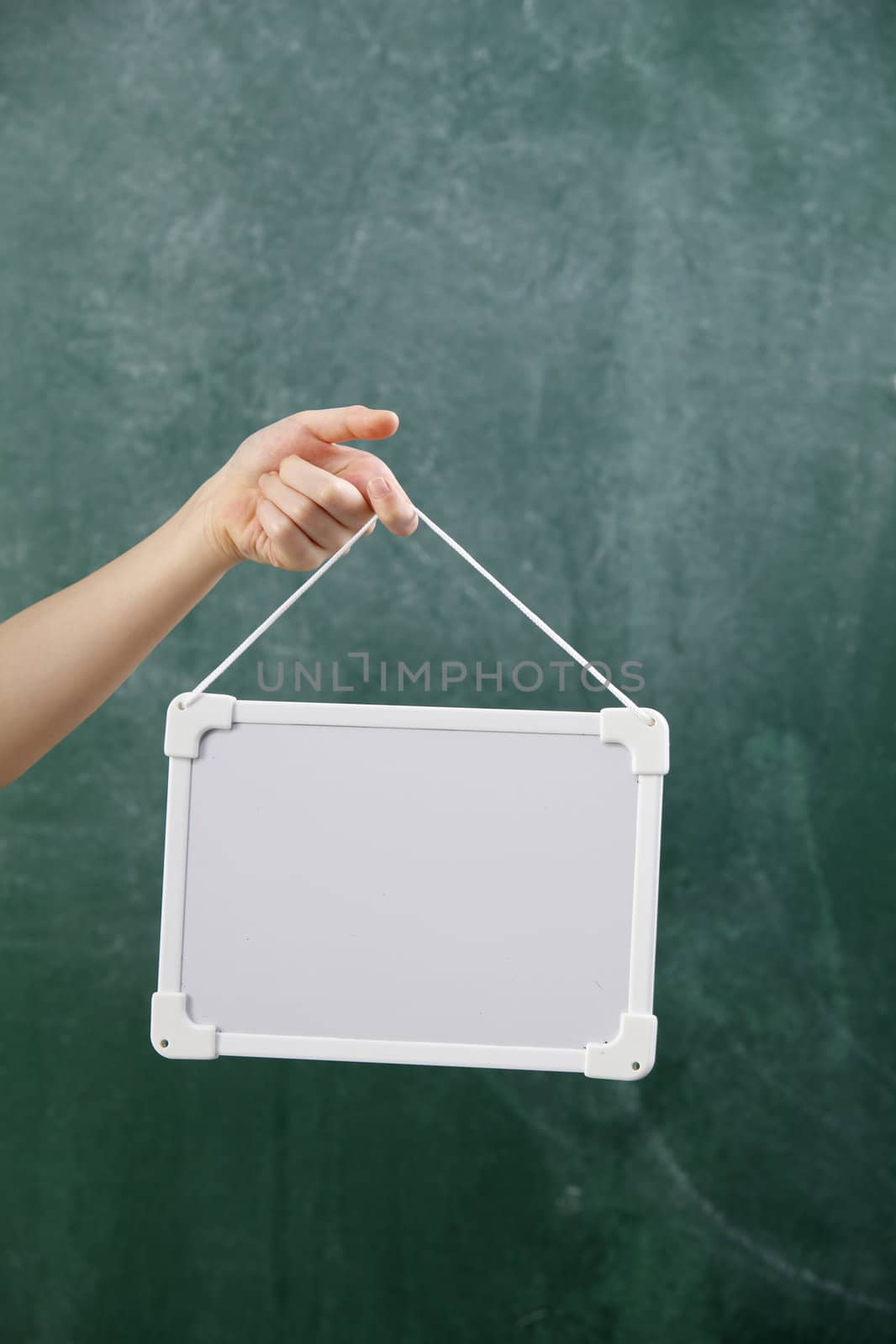 stock image of the hand holding white board