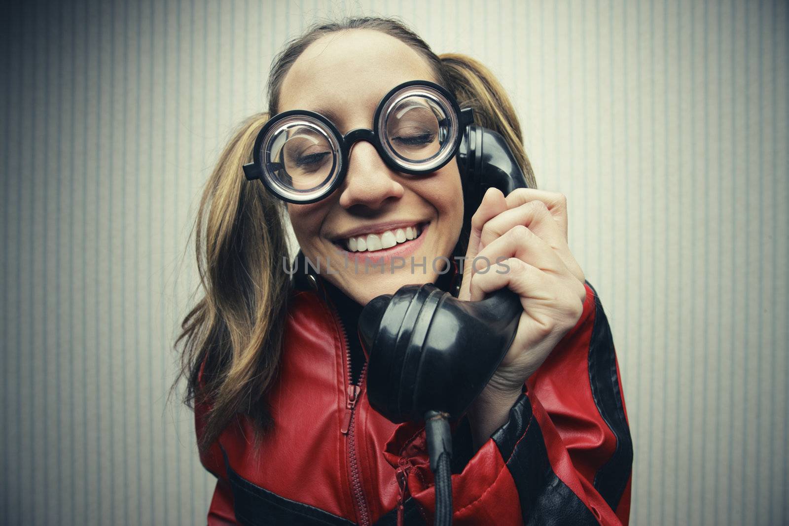 funny nerd humor woman talking retro vintage black telephone on vintage wallpaper