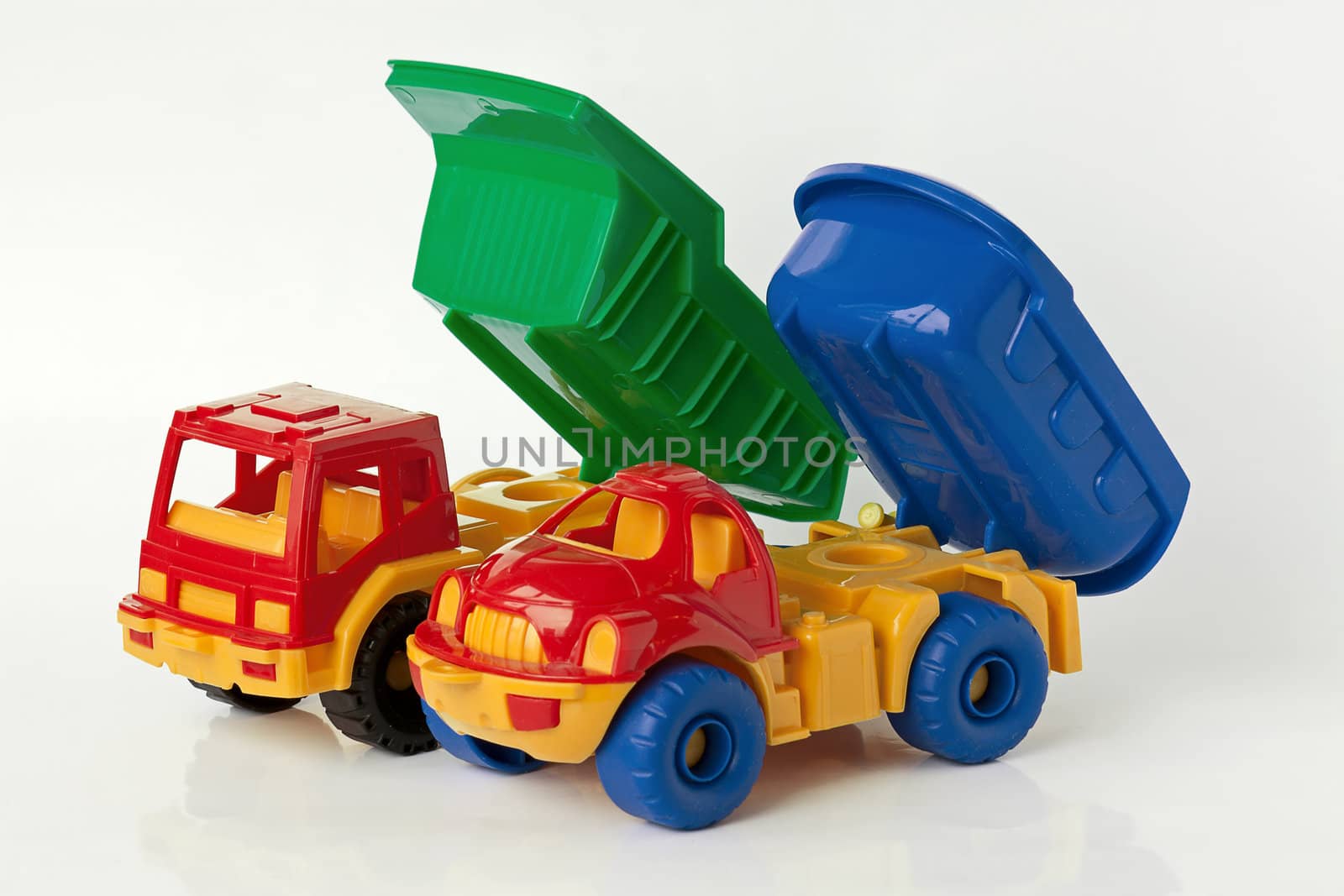 Two toy car on  white background. It's trucks.