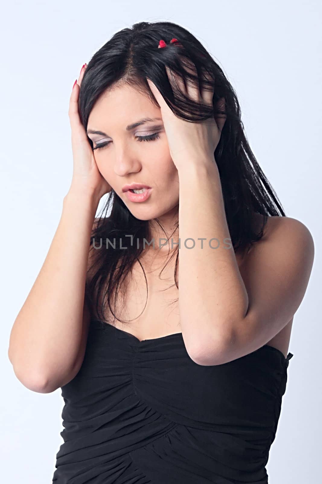Portrait of the young and beautiful girl which the head is ill