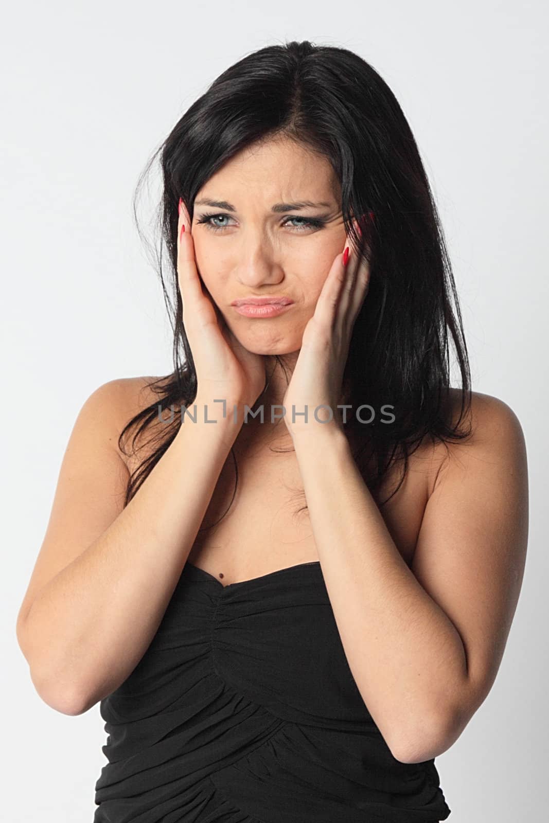 Portrait of the young and beautiful girl which the head is ill