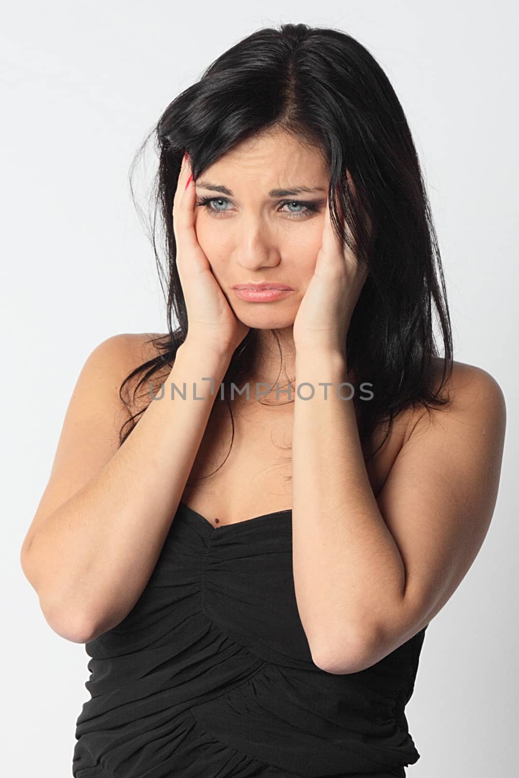 Portrait of the young and beautiful girl which the head is ill