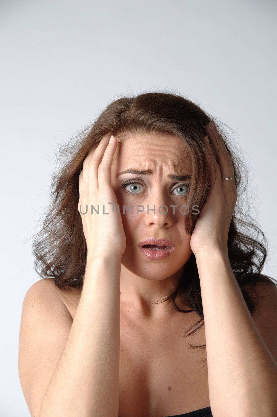 Portrait of the young and beautiful girl which the head is ill