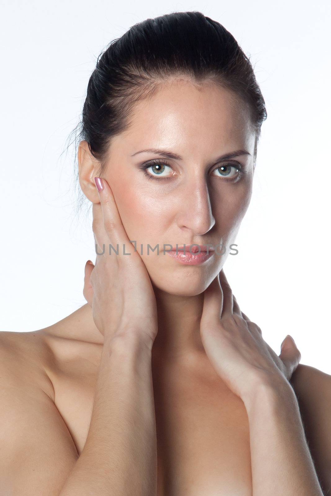 Portrait of the young and beautiful girl with naked shoulders