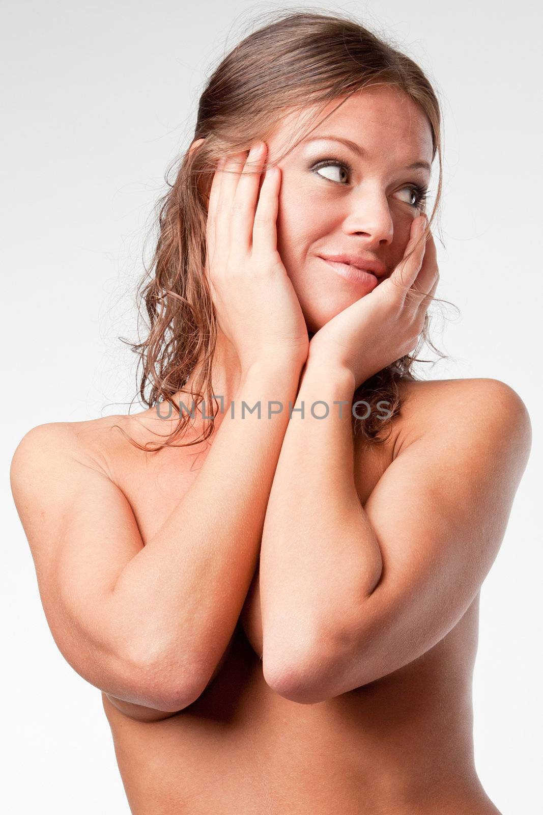 Portrait of the young and beautiful girl with naked shoulders