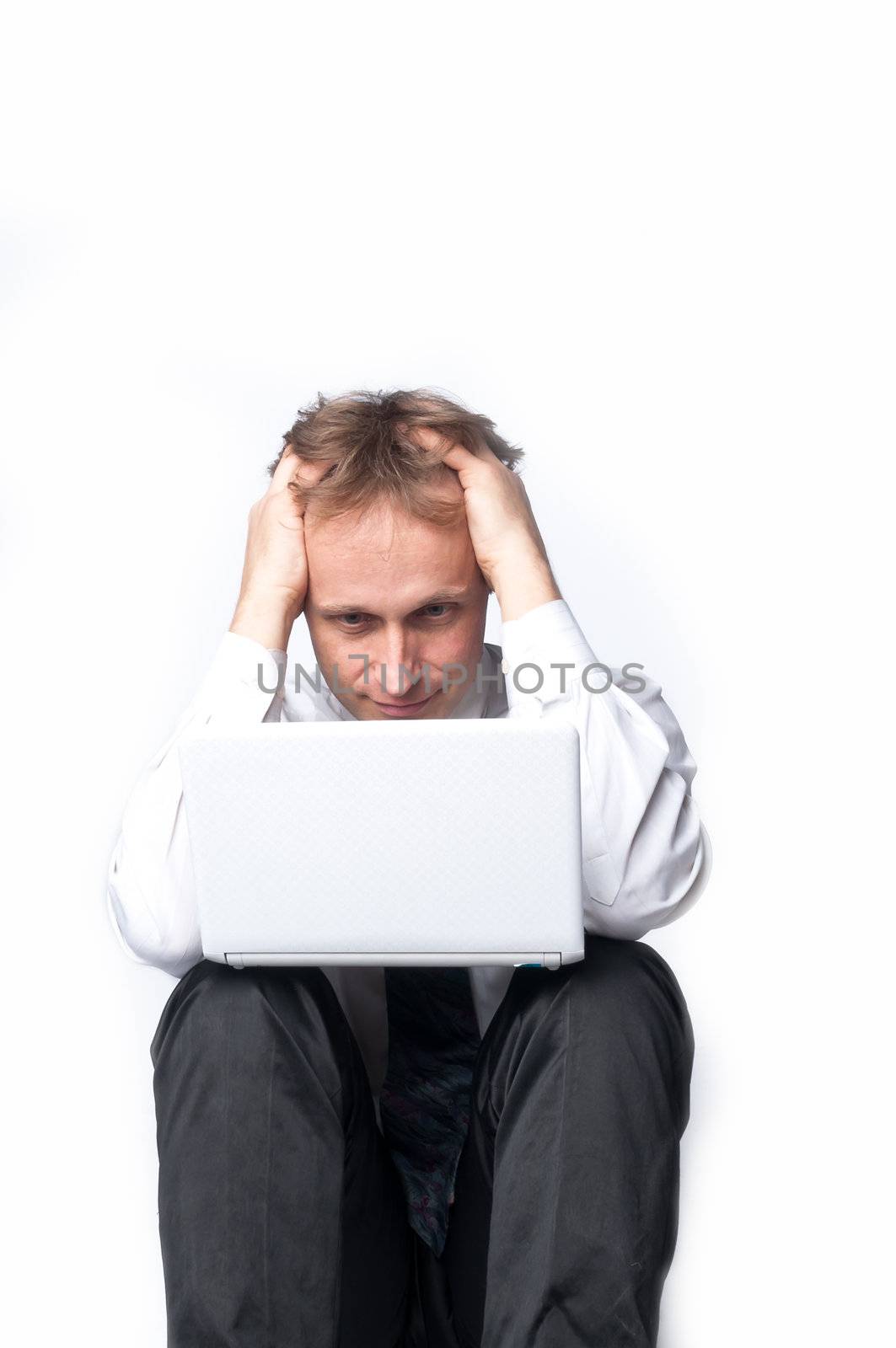 Portrait of middle-aged man with a white laptop computer