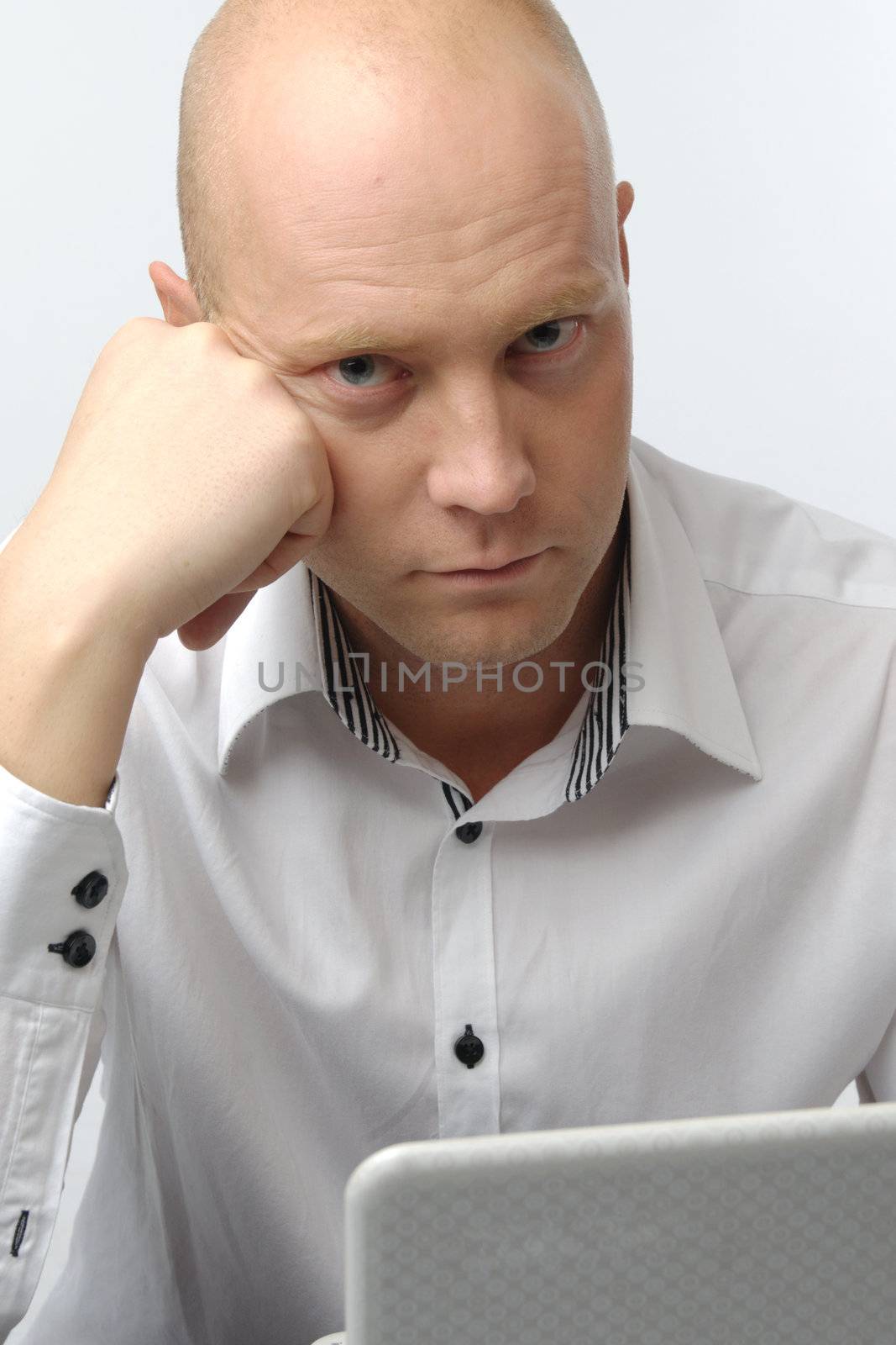 Portrait of middle-aged man with a white laptop computer