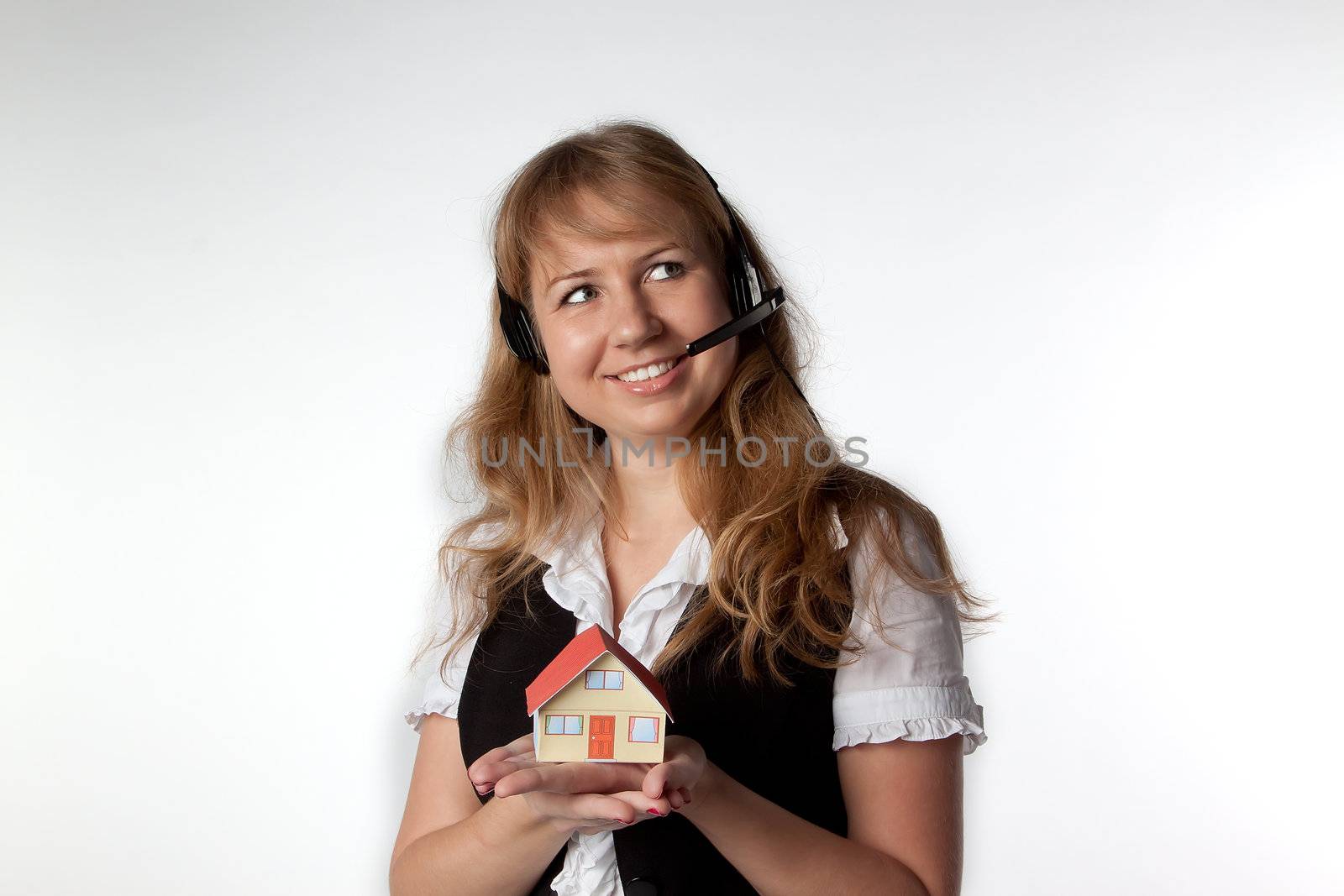 Little House in the hands of young and beautiful business woman