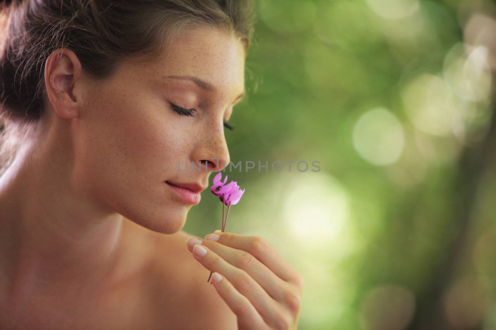 Portrait of Fresh and Beautiful woman with flower