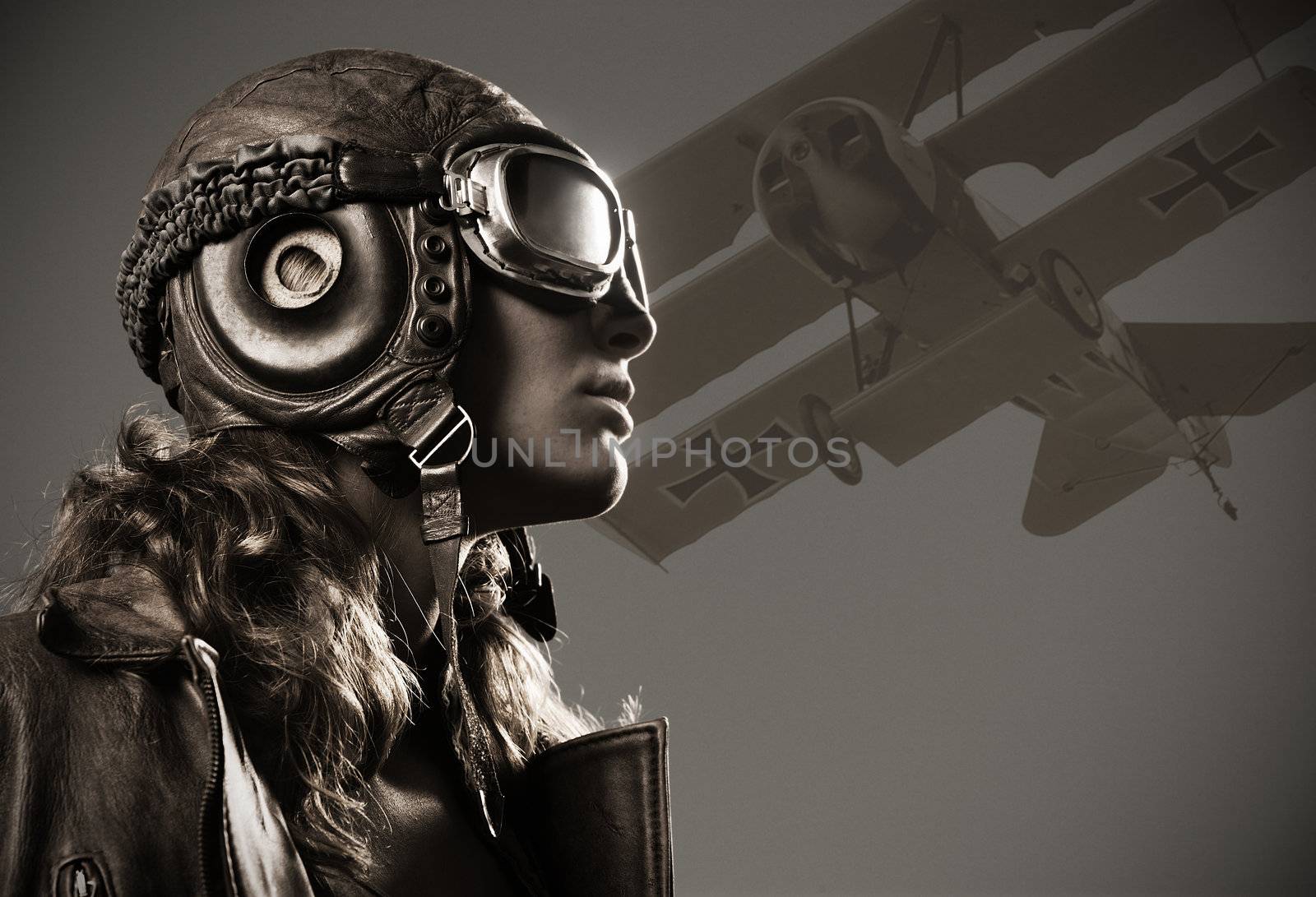 Portrait of young woman airplane pilot