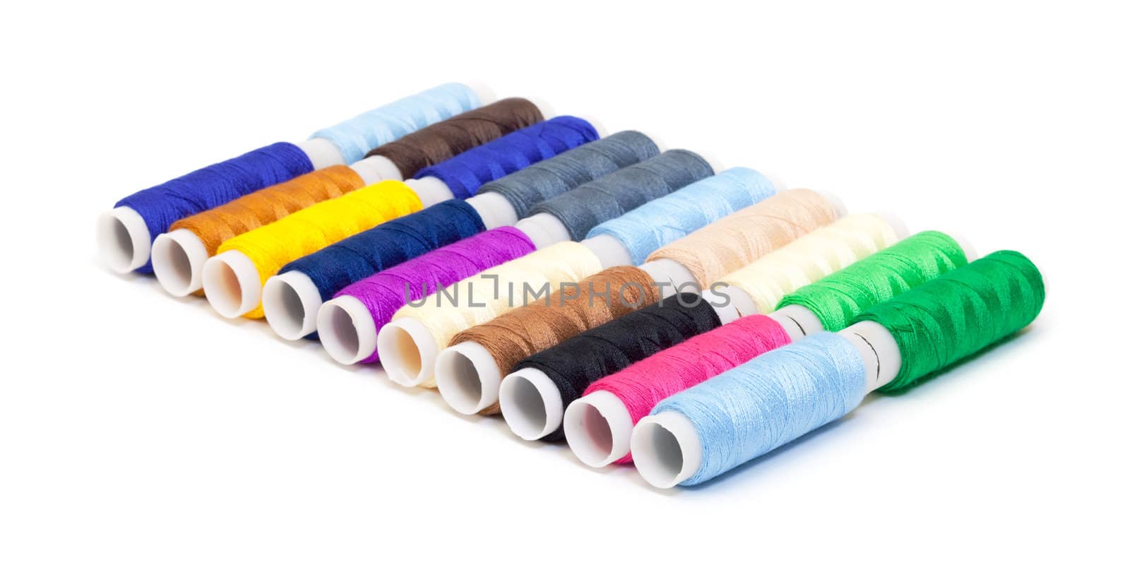 Several Multicolor Spools of Thread on white background