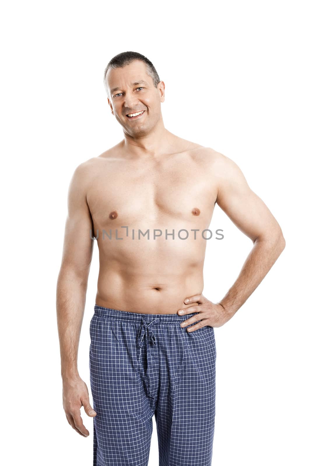 An image of a handsome man in pajamas shirtless