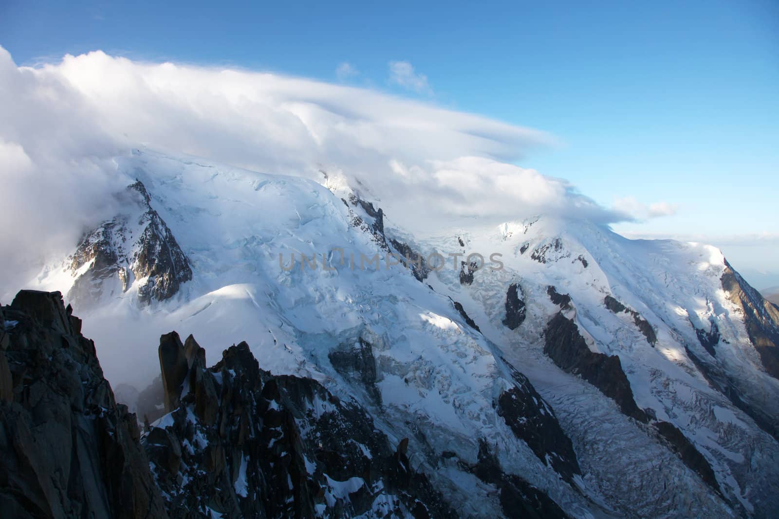 The mont blanc from Aiguille du Midi, the peak within the clouds.