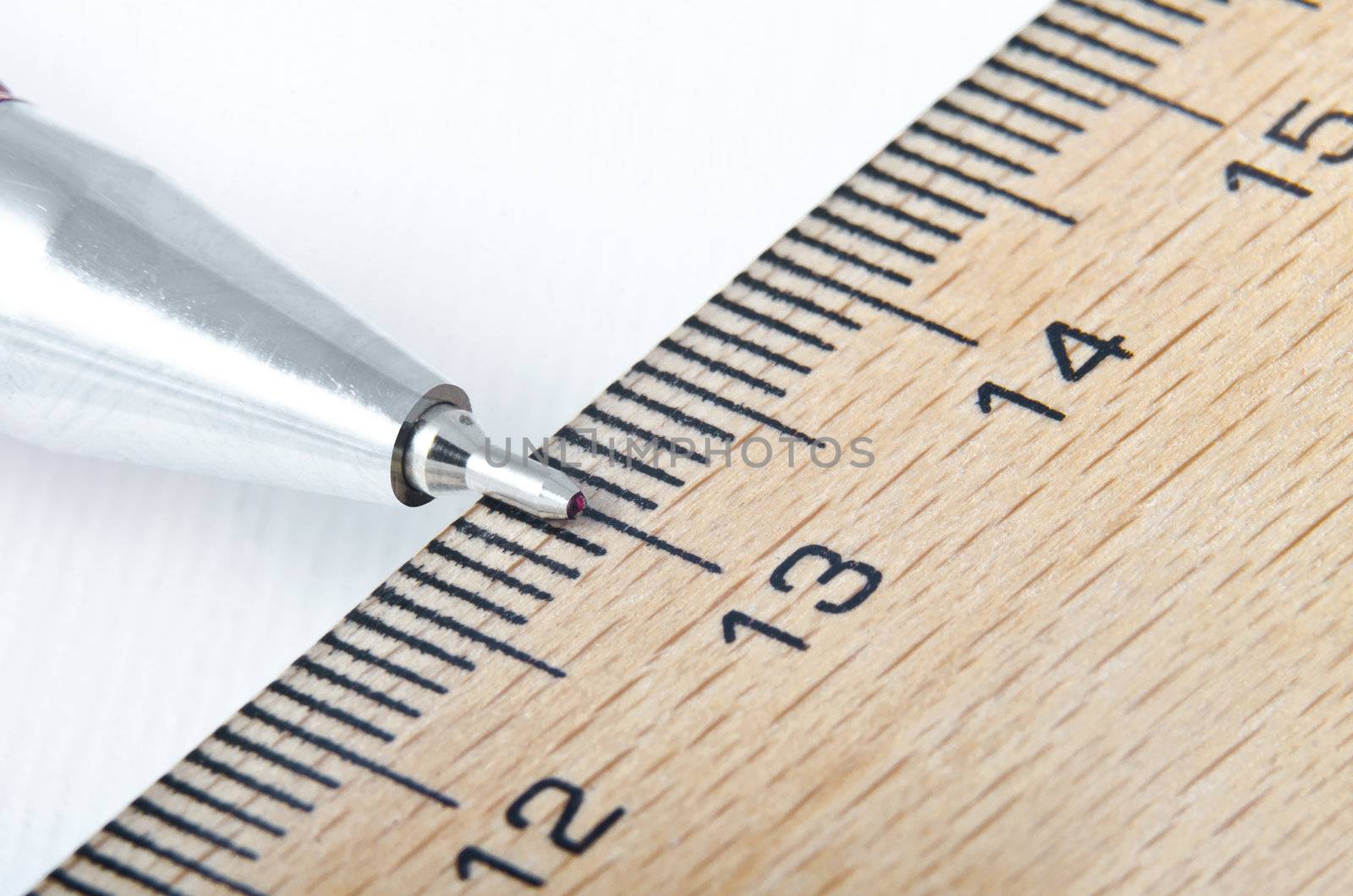 ruler and pencil on the white background extreme closeup