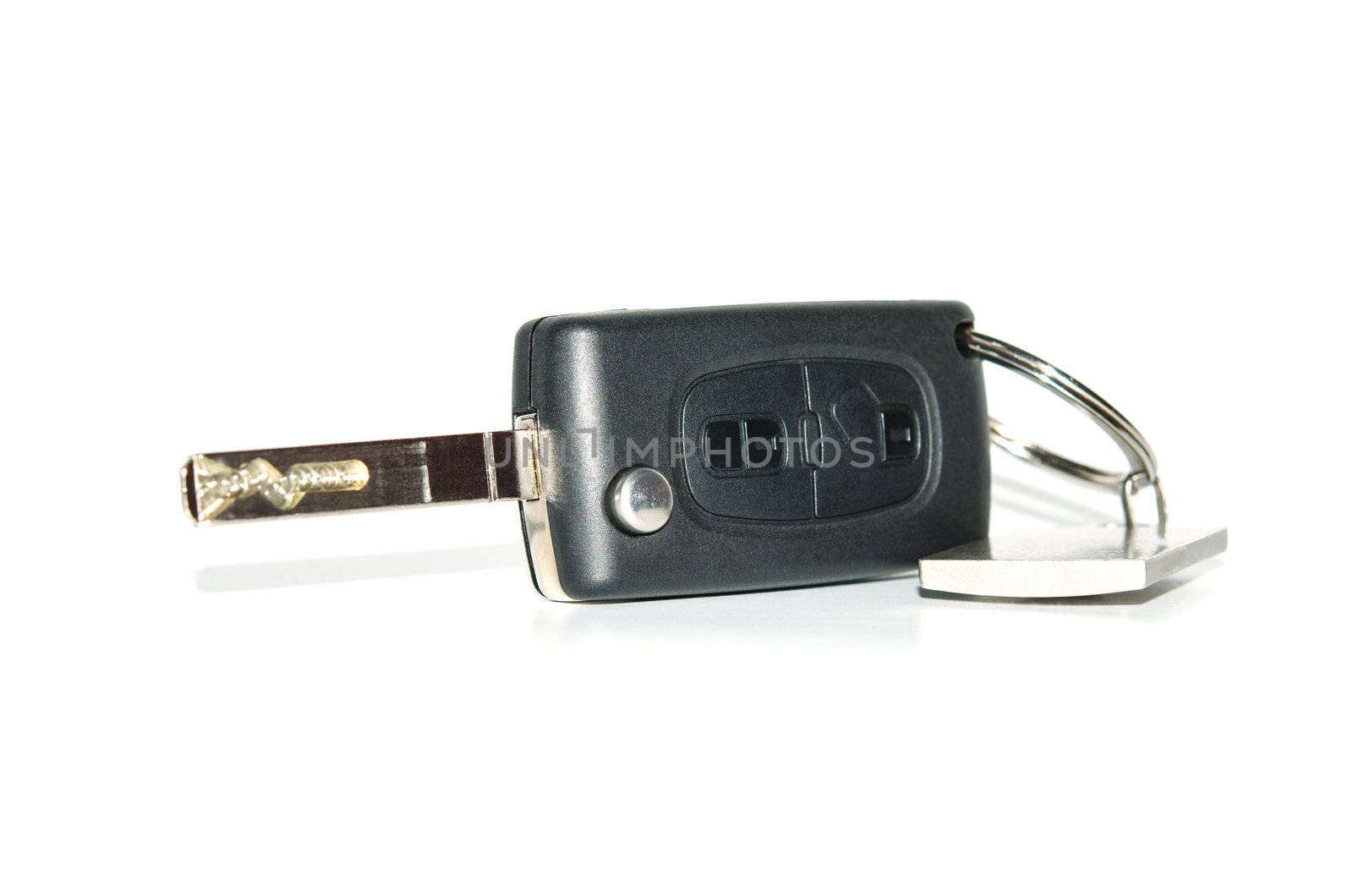 Car key isolated on white with shadows and reflection