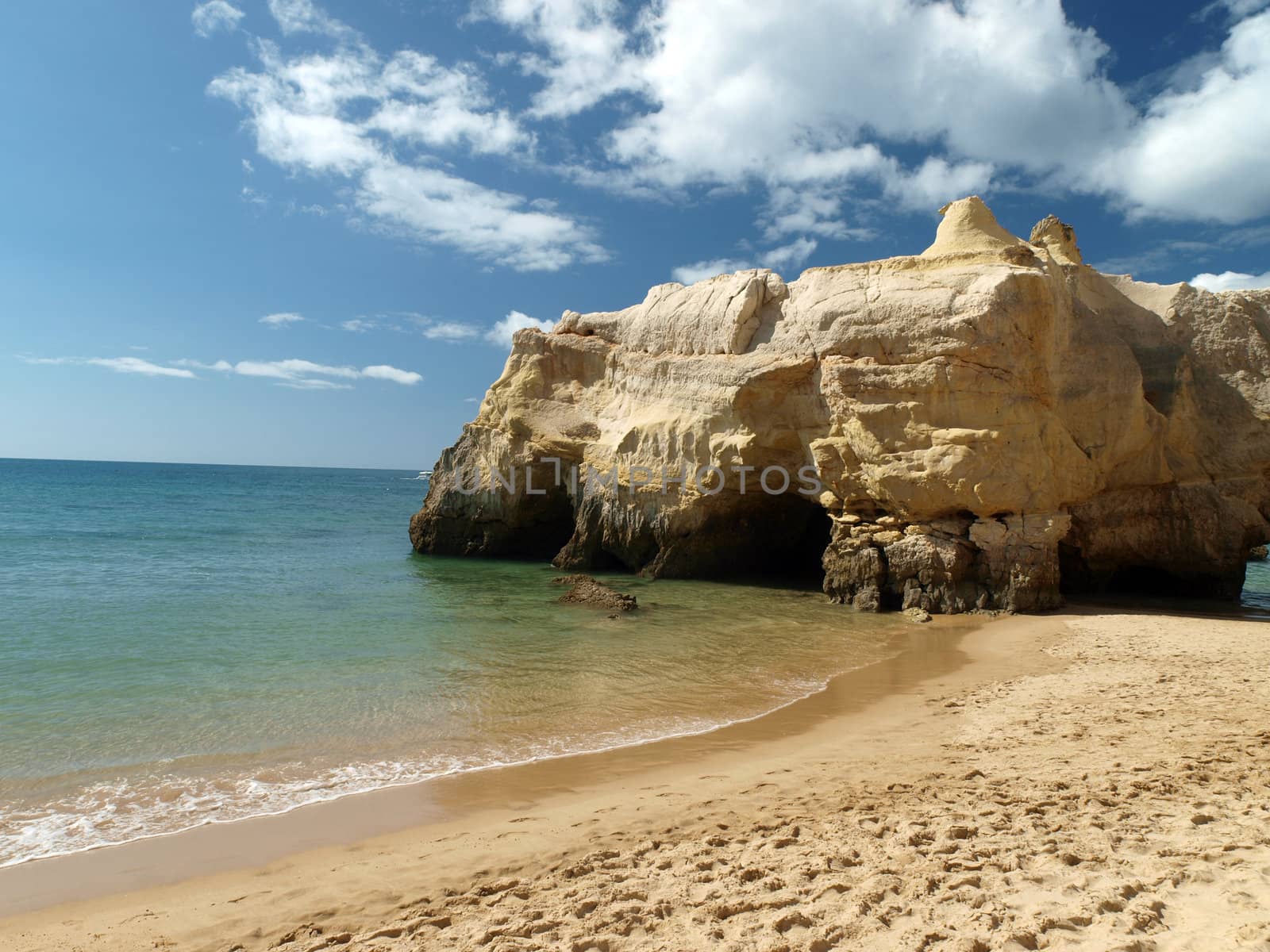 A section of the idyllic Praia de Rocha beach on the southern coast of the Portuguese Algarve region.