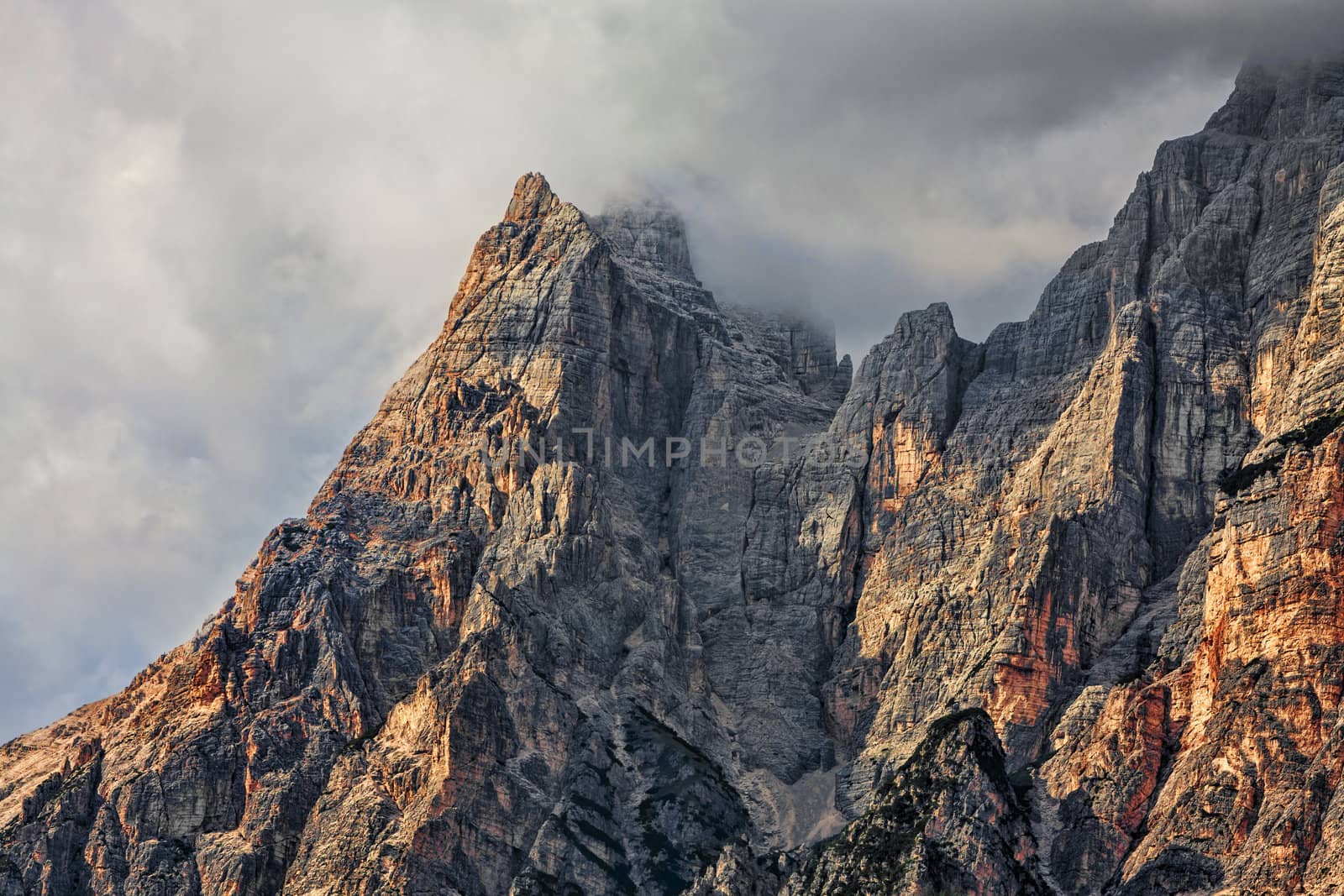 High altitude peaks and clouds in Dolomites Mountains in Italy.