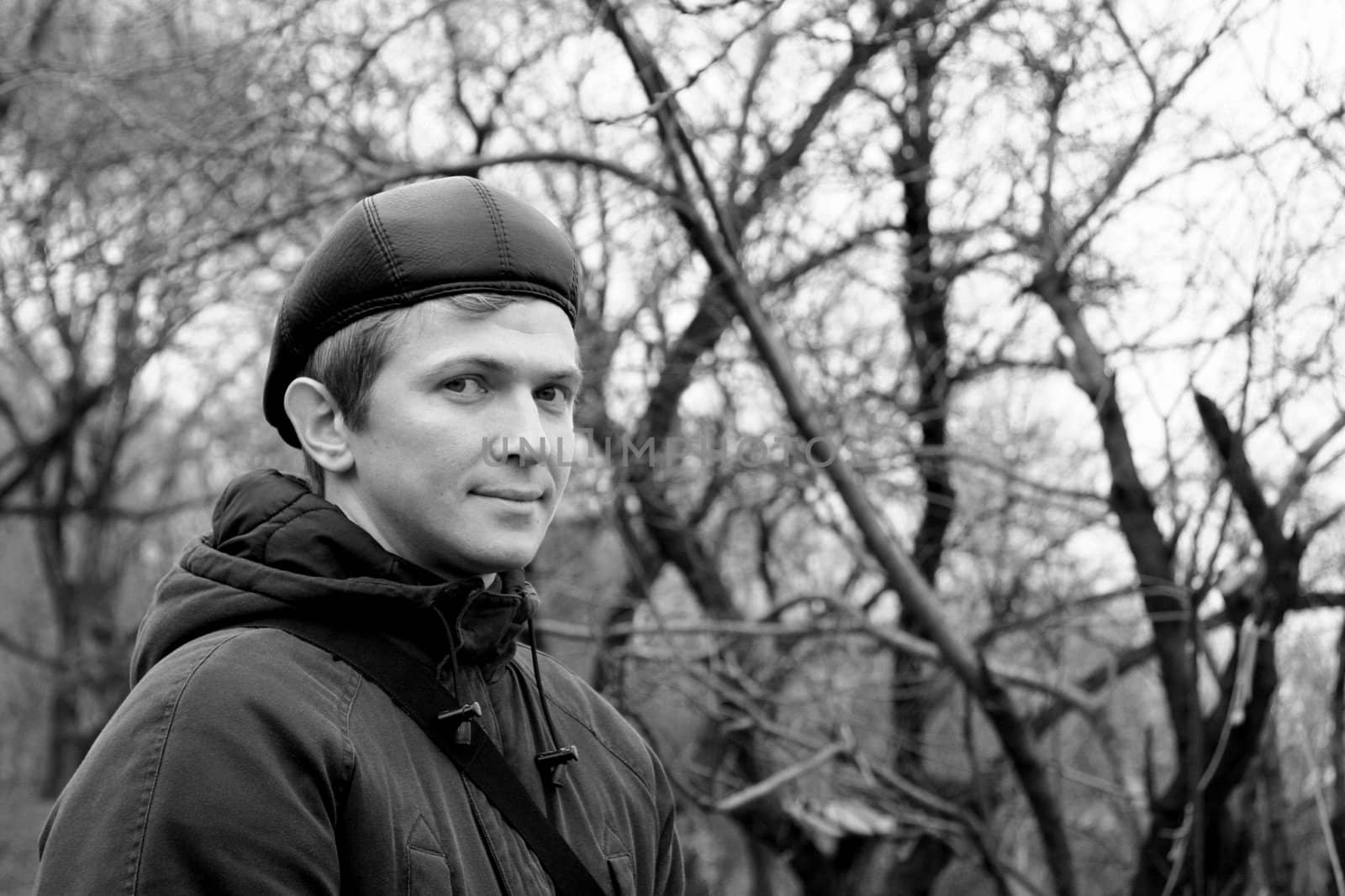 smiling lad on background of the park