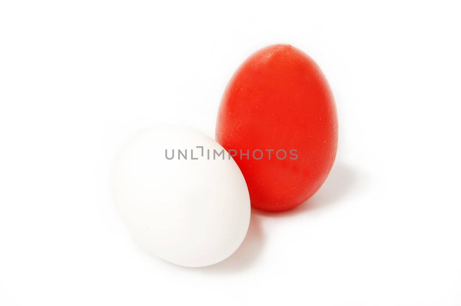 Red and white egg isolated on white