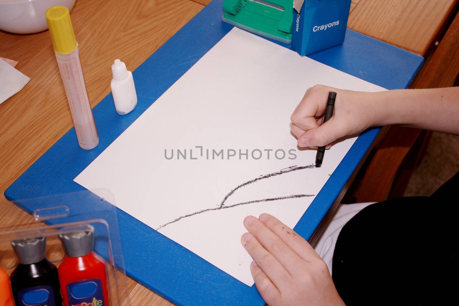 child making simple drawing