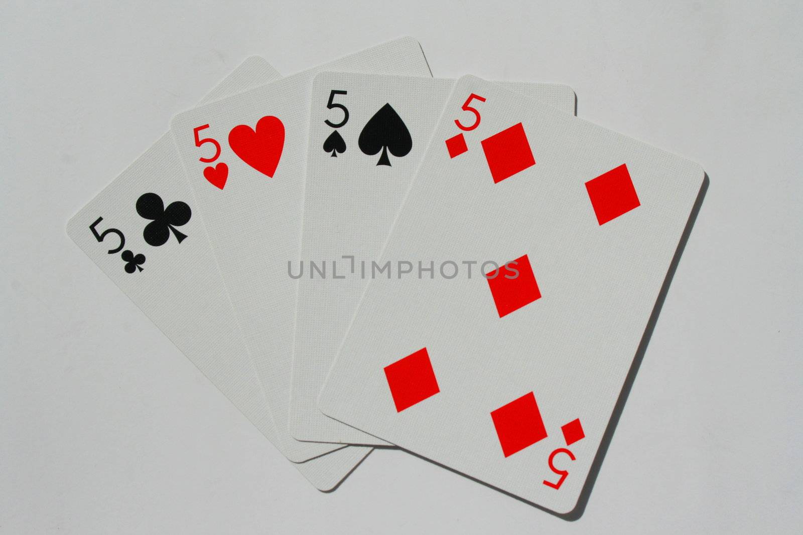 Close up of four fives on a white background.
