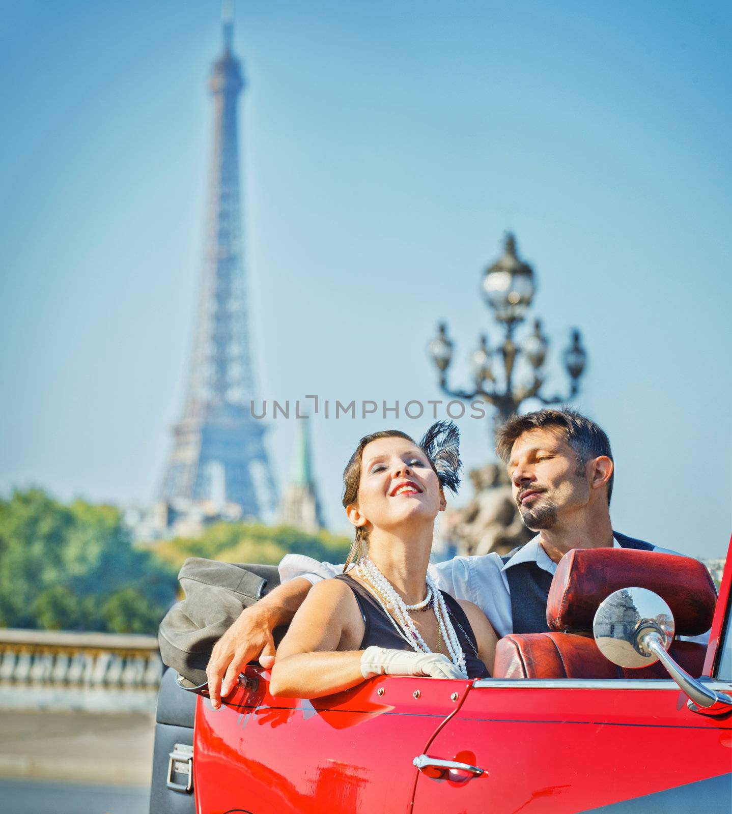 Happy smiling couple in a car. Romance in Paris. by maxoliki