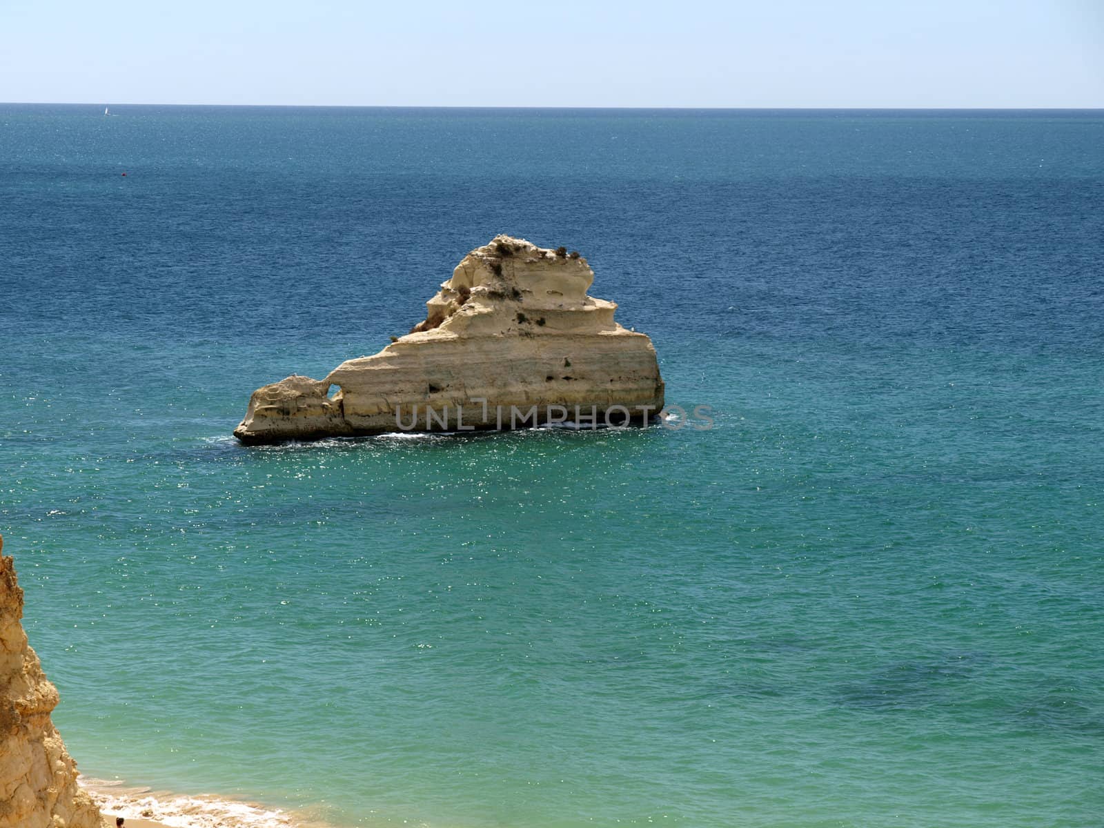 A lonely rock in the ocean. The effect of erosion