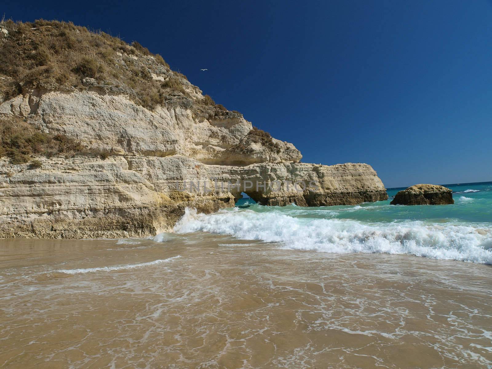 A section of the idyllic Praia de Rocha beach on the southern coast of the Portuguese Algarve region.