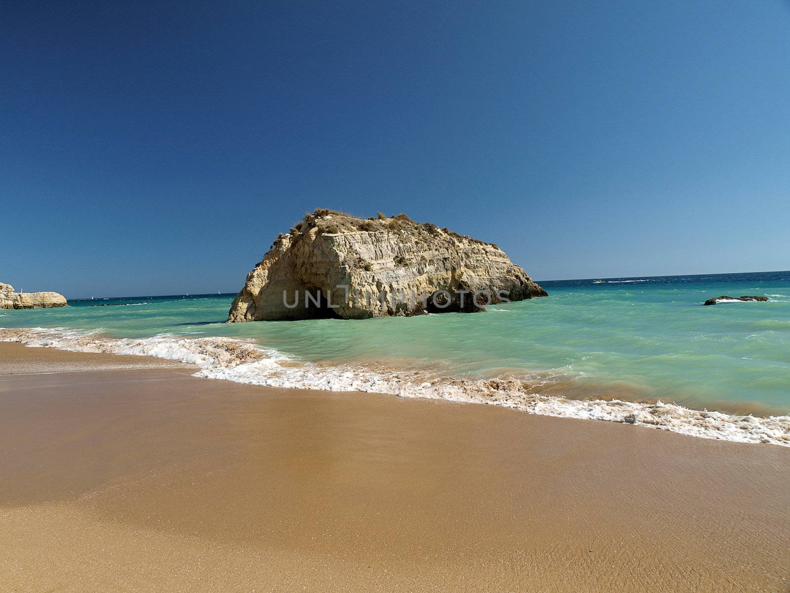 A section of the idyllic Praia de Rocha beach on the southern coast of the Portuguese Algarve region.