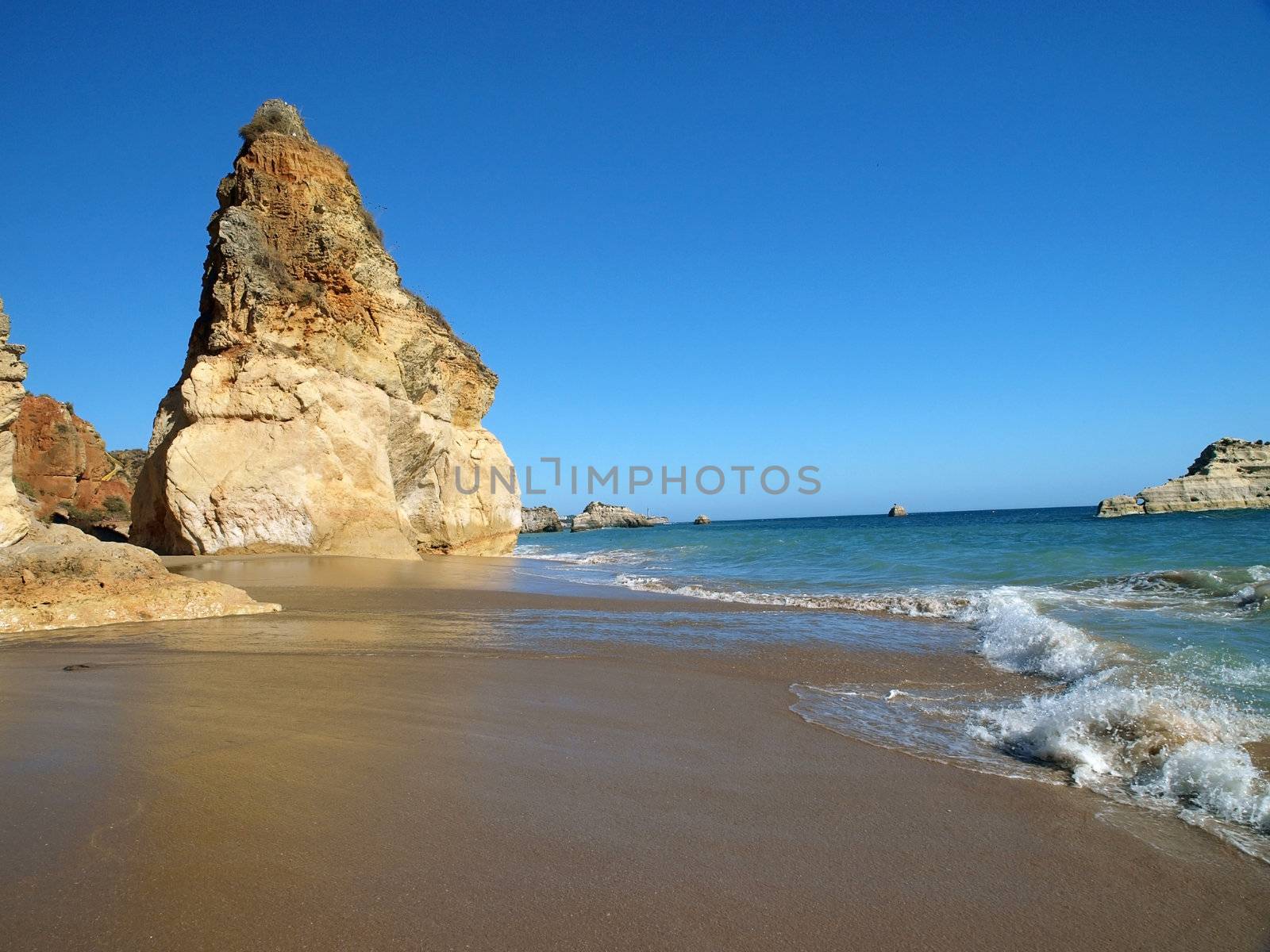 A section of the idyllic Praia de Rocha beach on the southern coast of the Portuguese Algarve region.