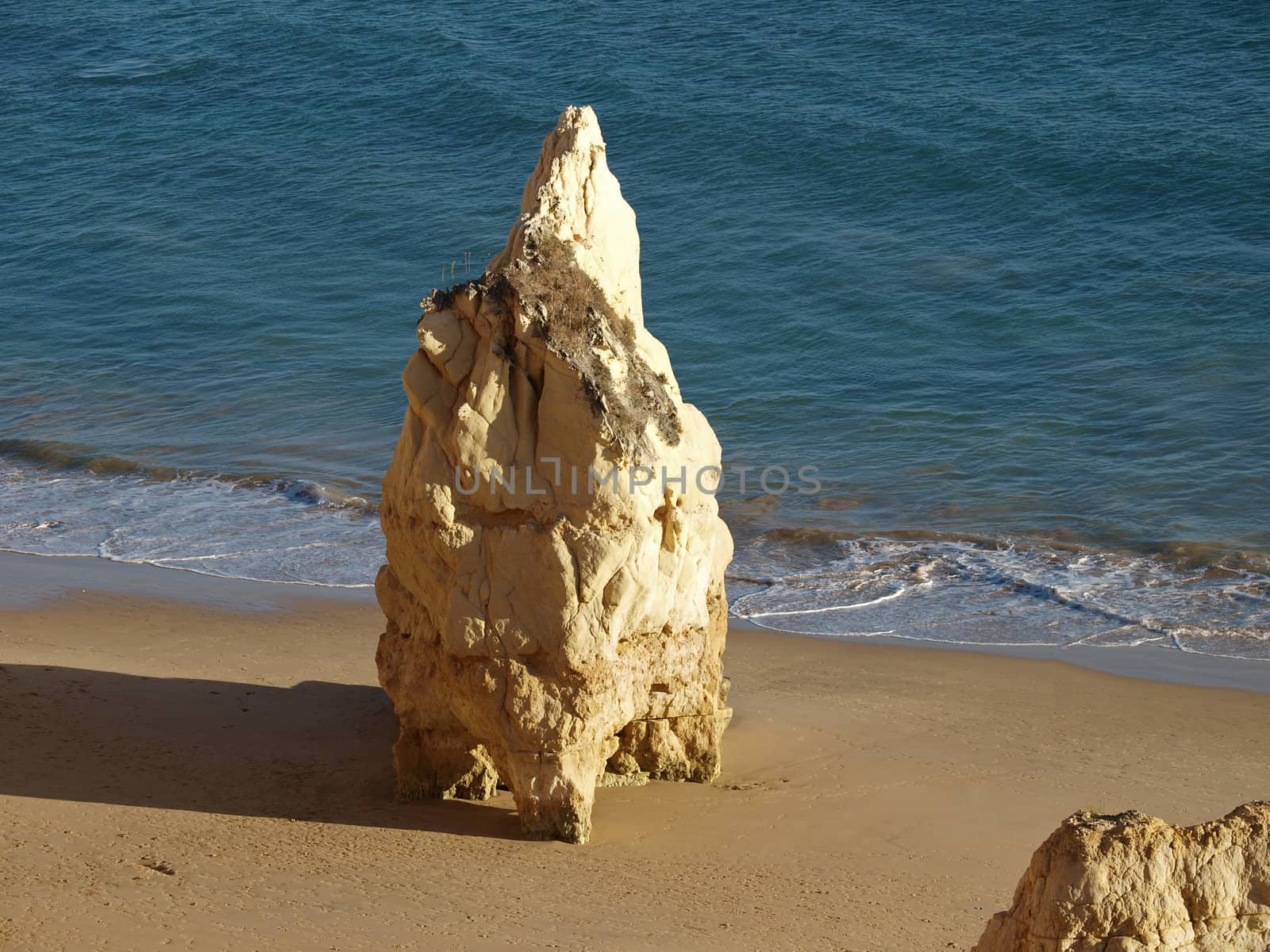 A lonely rock in the ocean. The effect of erosion