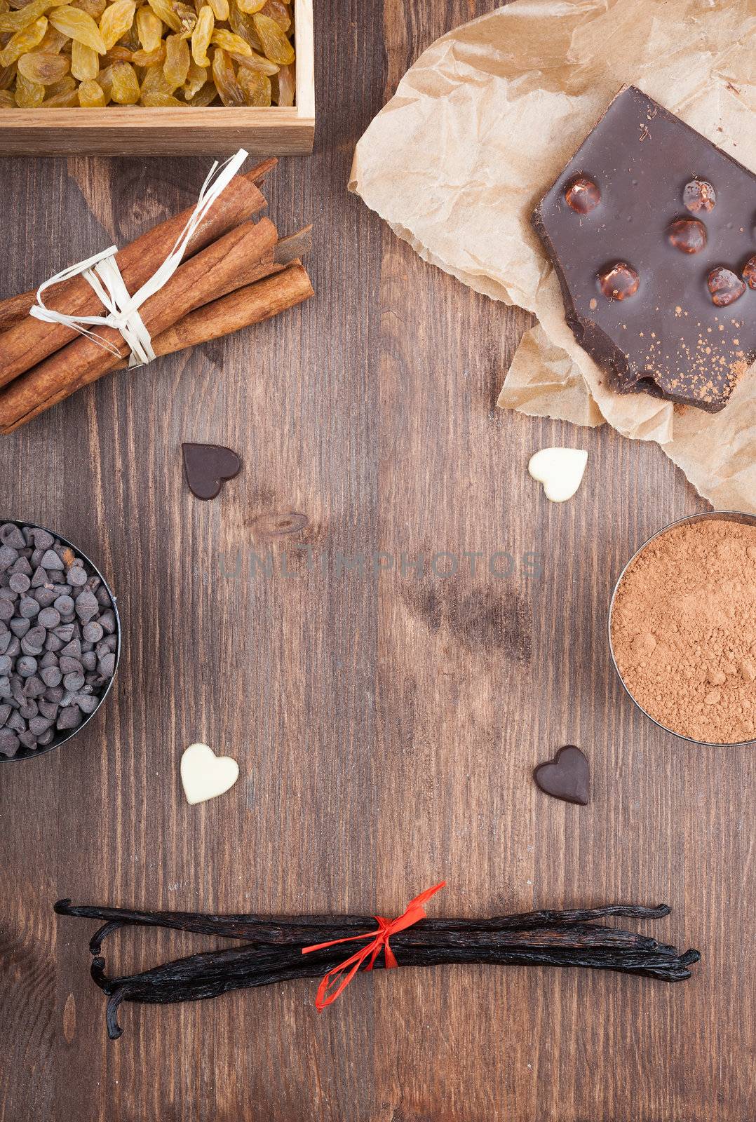 Ingredients for baking chocolate on a dark wooden background