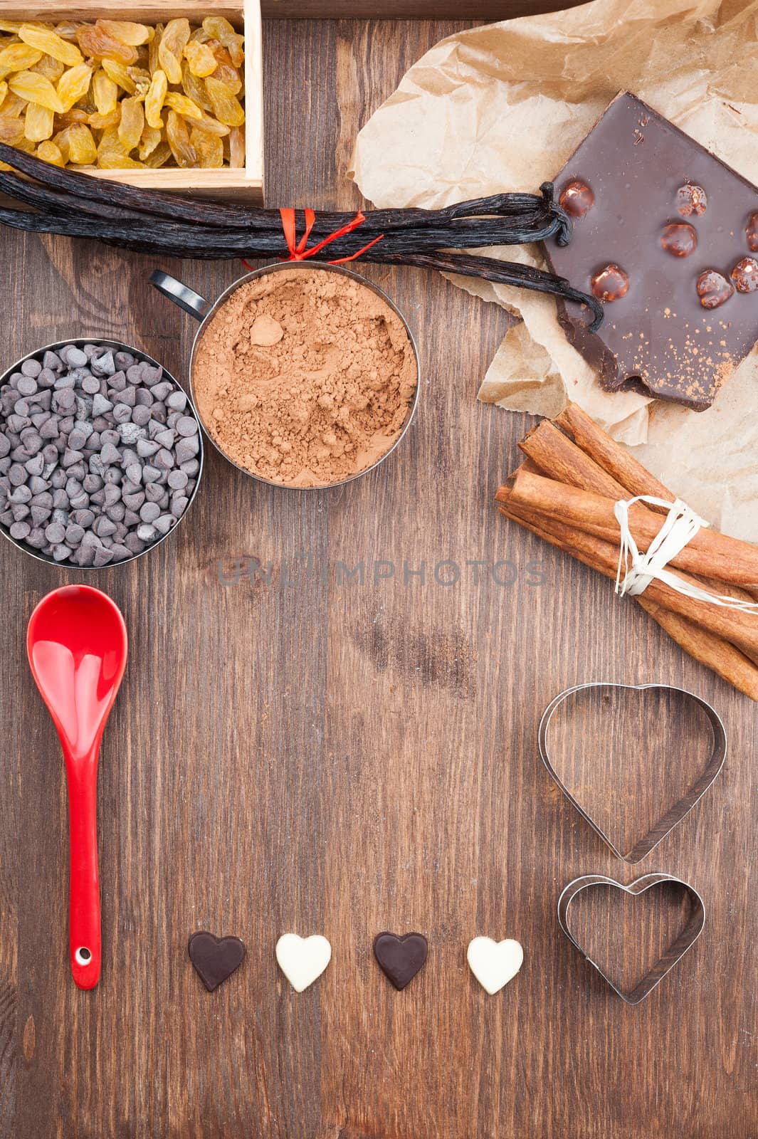 Ingredients for baking chocolate on a dark wooden background