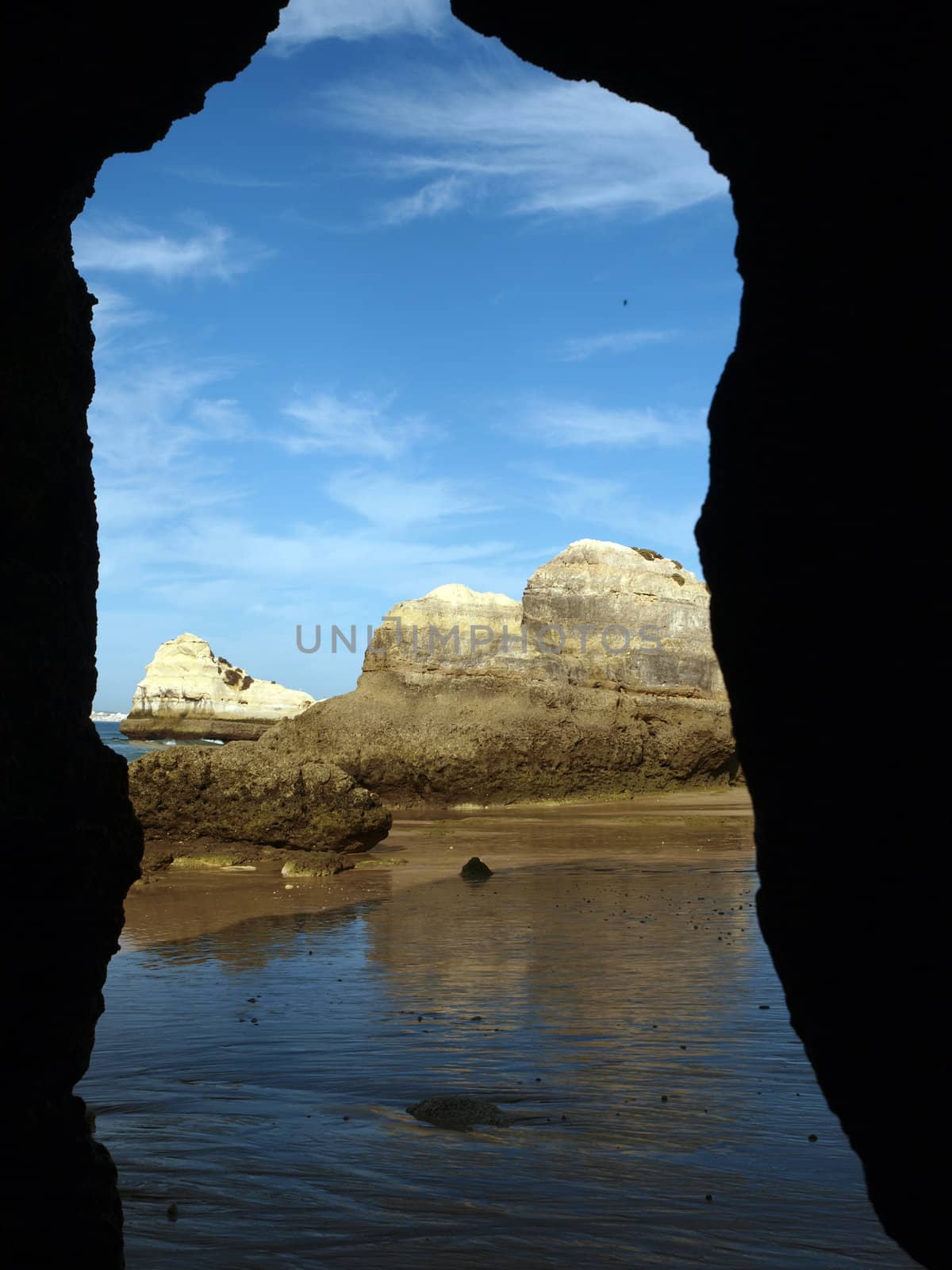 Caves and colourful rock formations on the Algarve coast in Portugal