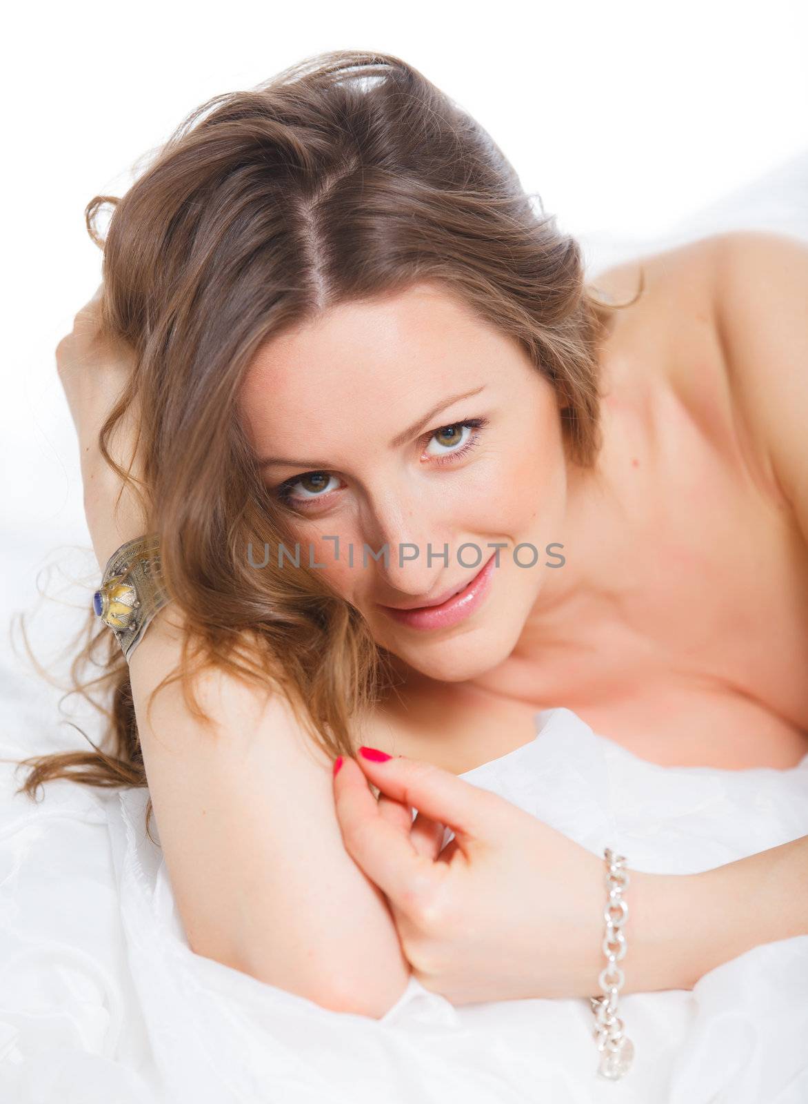 Portrait of beautiful young woman lying on the floor
