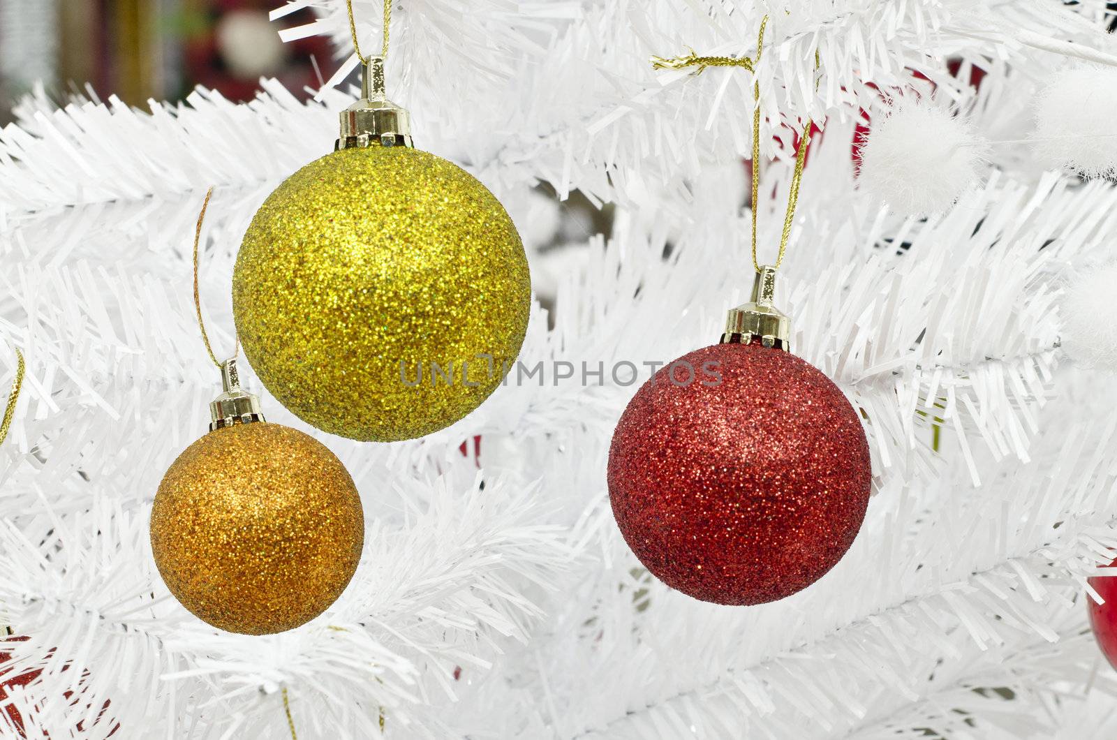 new year and christmass balls on white pine background