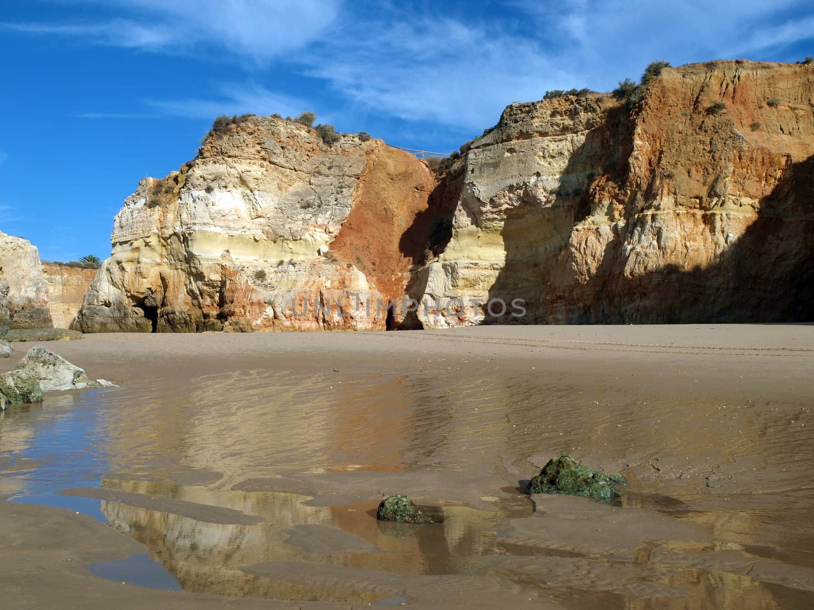 Caves and colourful rock formations on the Algarve coast in Portugal