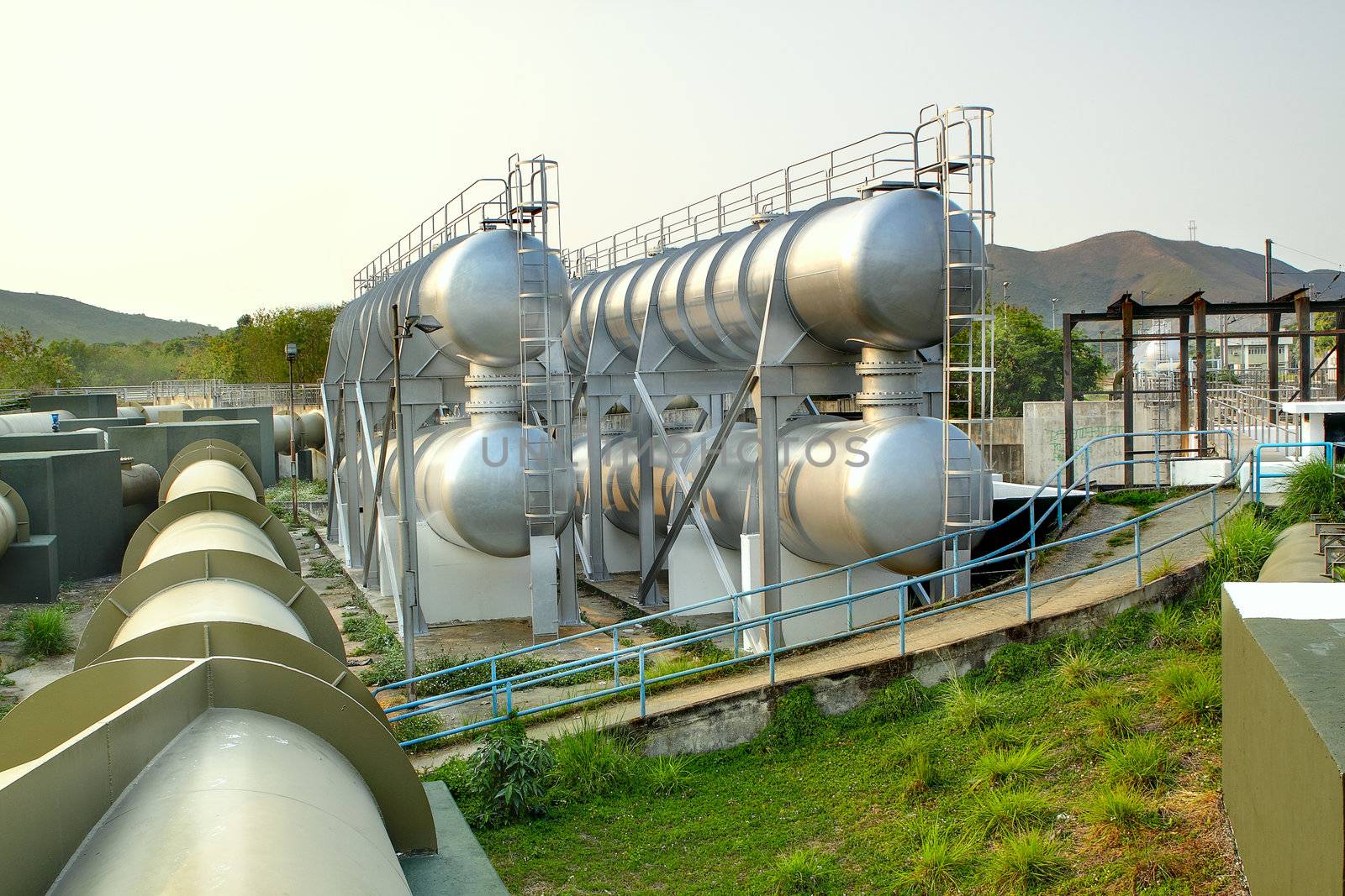 oil tanks and pipes outdoor at day 