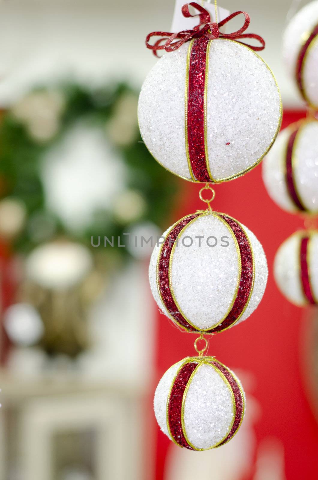 Merry Christmas and Happy new year, New Year's white ball with red ribon on a red background abstract background lights