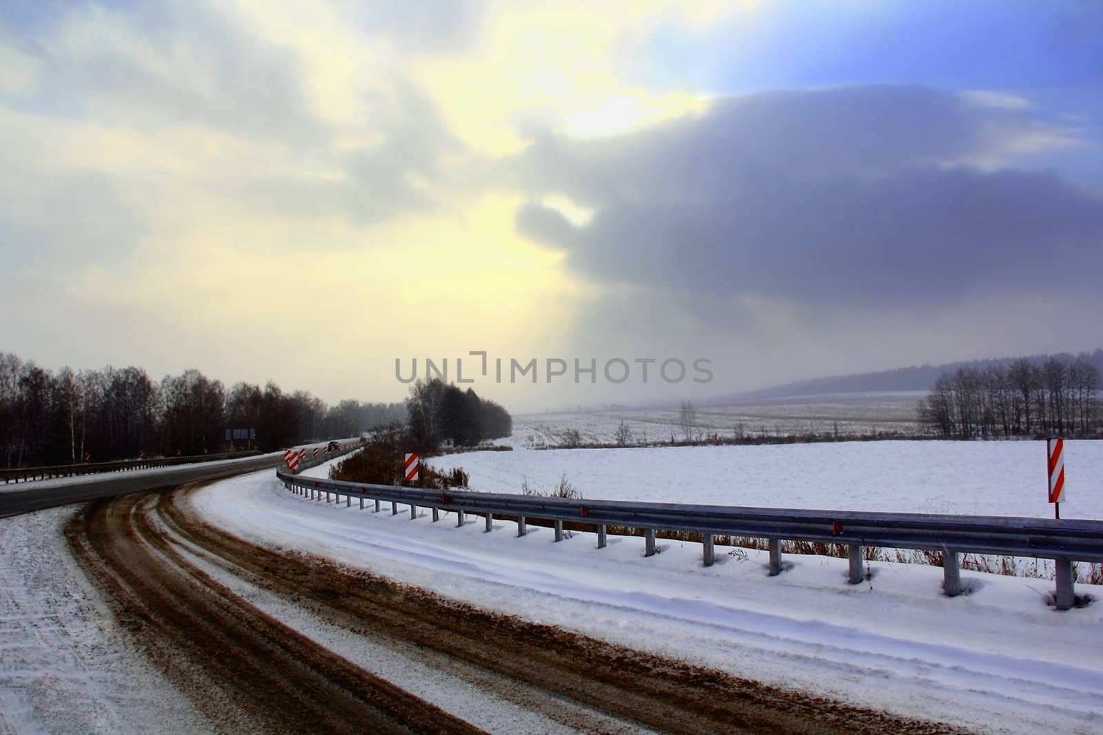 Image of winter road and cloudy sky