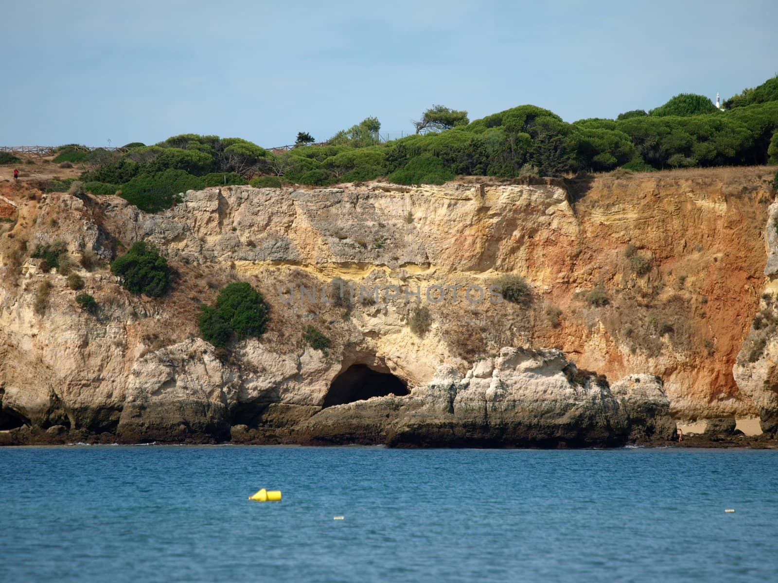 Caves and colourful rock formations on the Algarve coast in Portugal