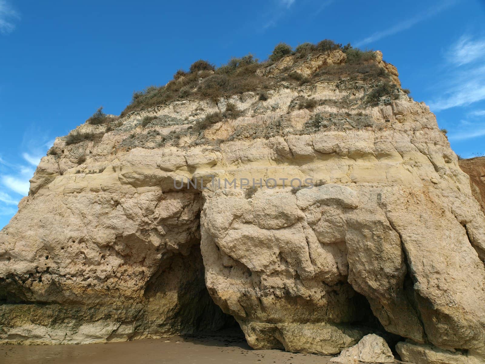 Caves and colourful rock formations on the Algarve coast in Portugal