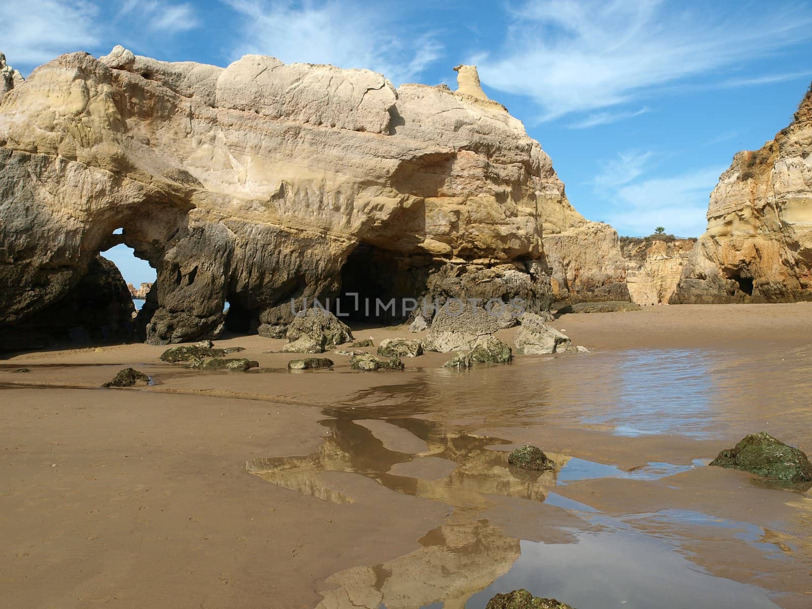 Caves and colourful rock formations on the Algarve coast in Portugal