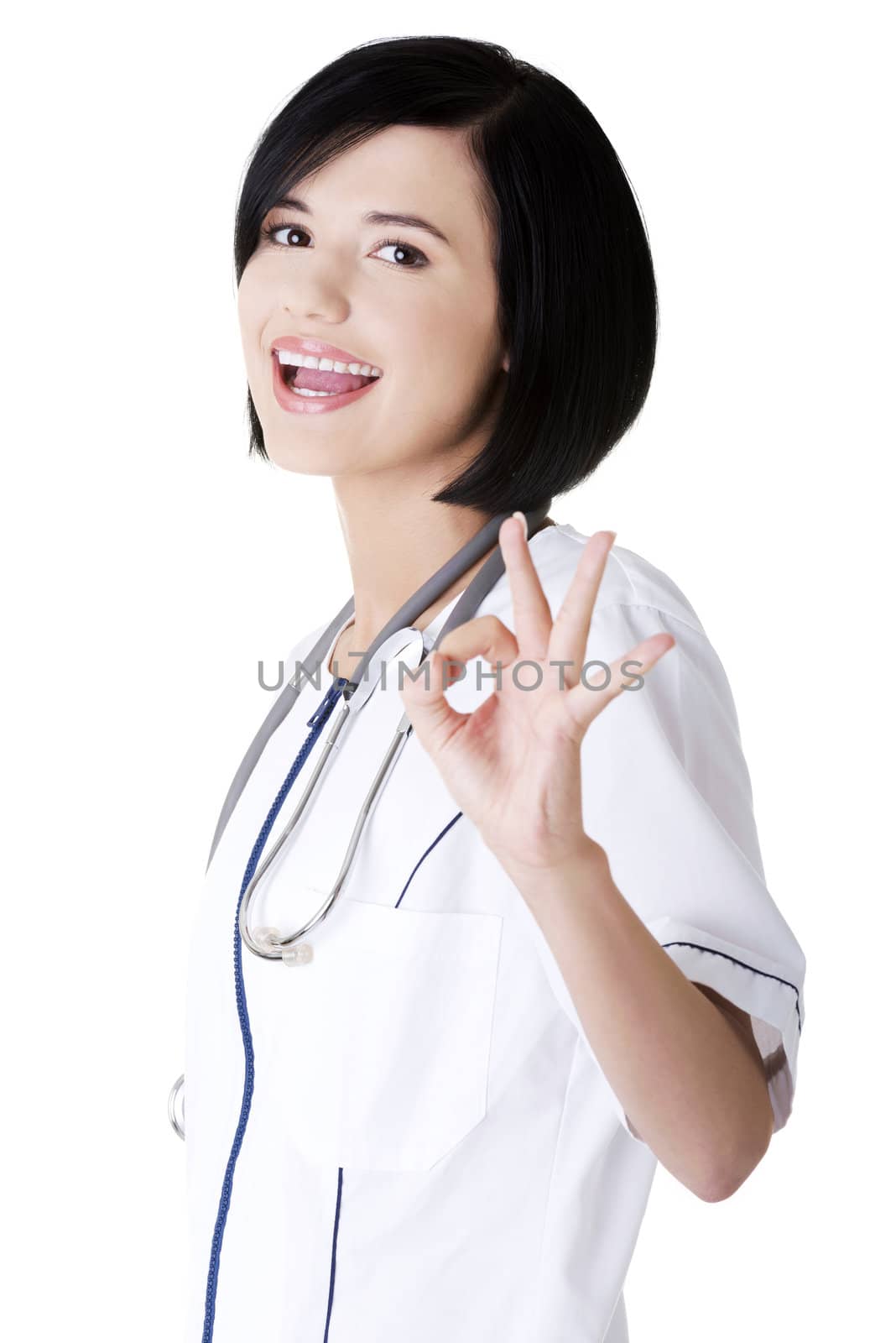 Young female doctor or nurse gesturing perfect
