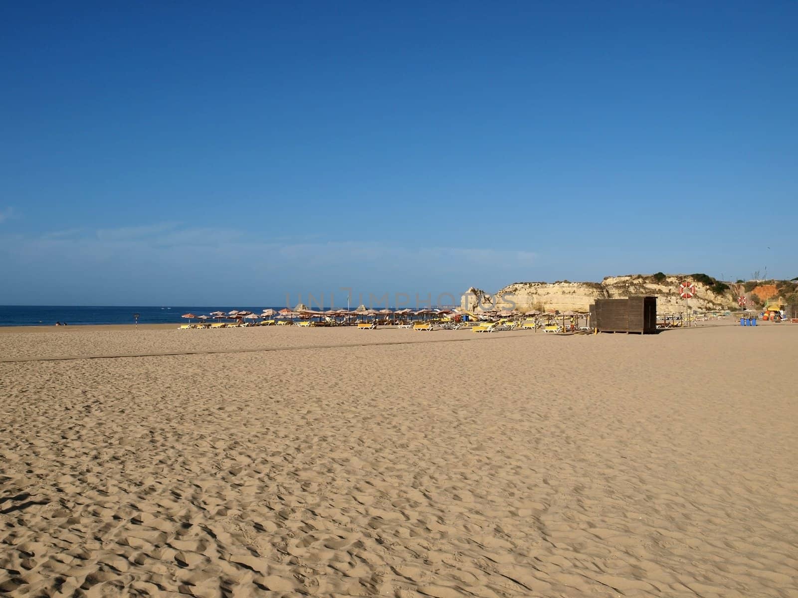 A section of the idyllic Praia de Rocha beach on the southern coast of the Portuguese Algarve region.