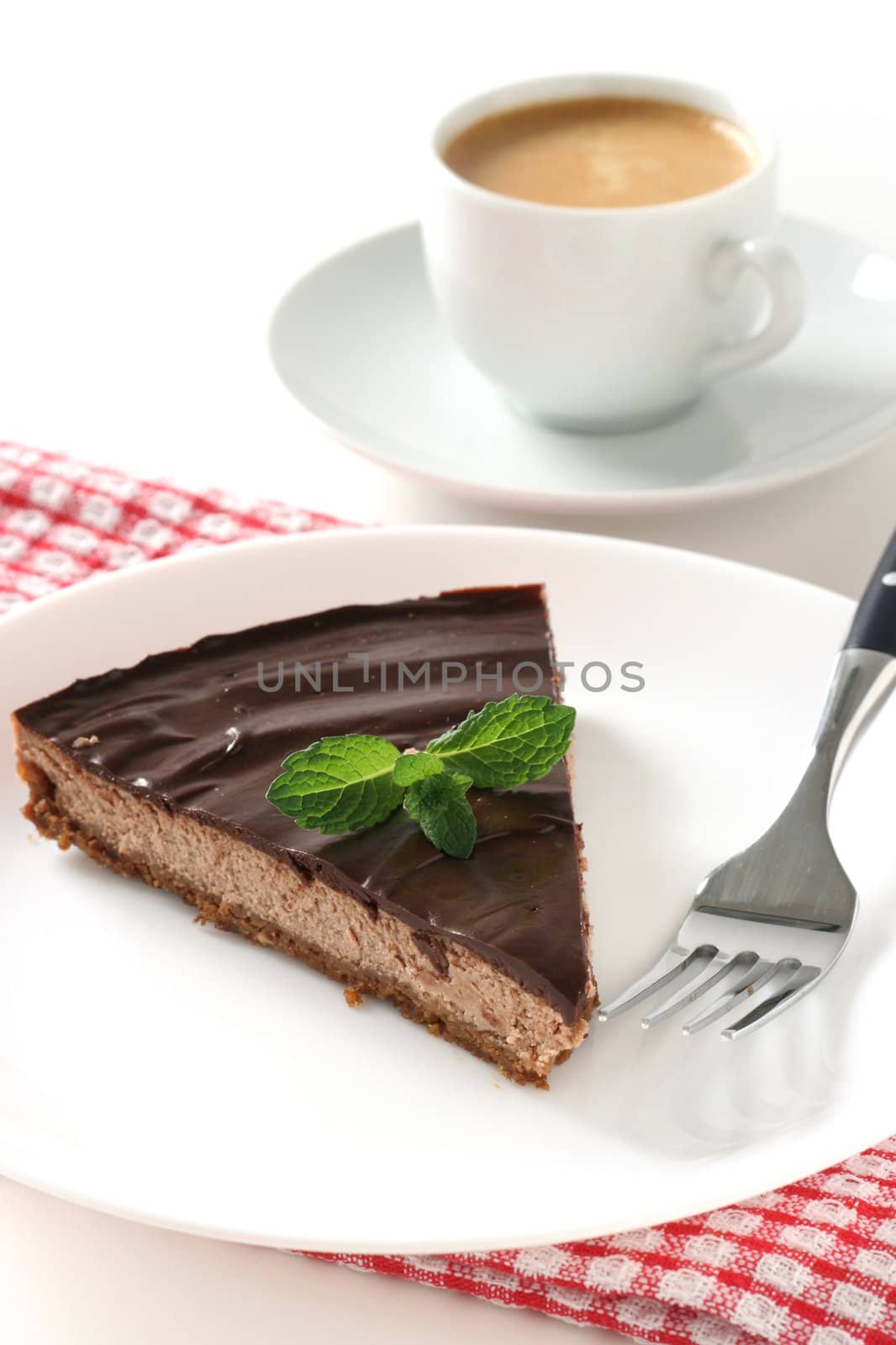 chocolate cheesecake  on plate by nataliamylova