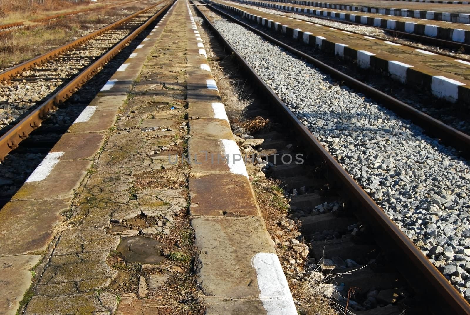 Railway station platforms and lines close-up, perspective